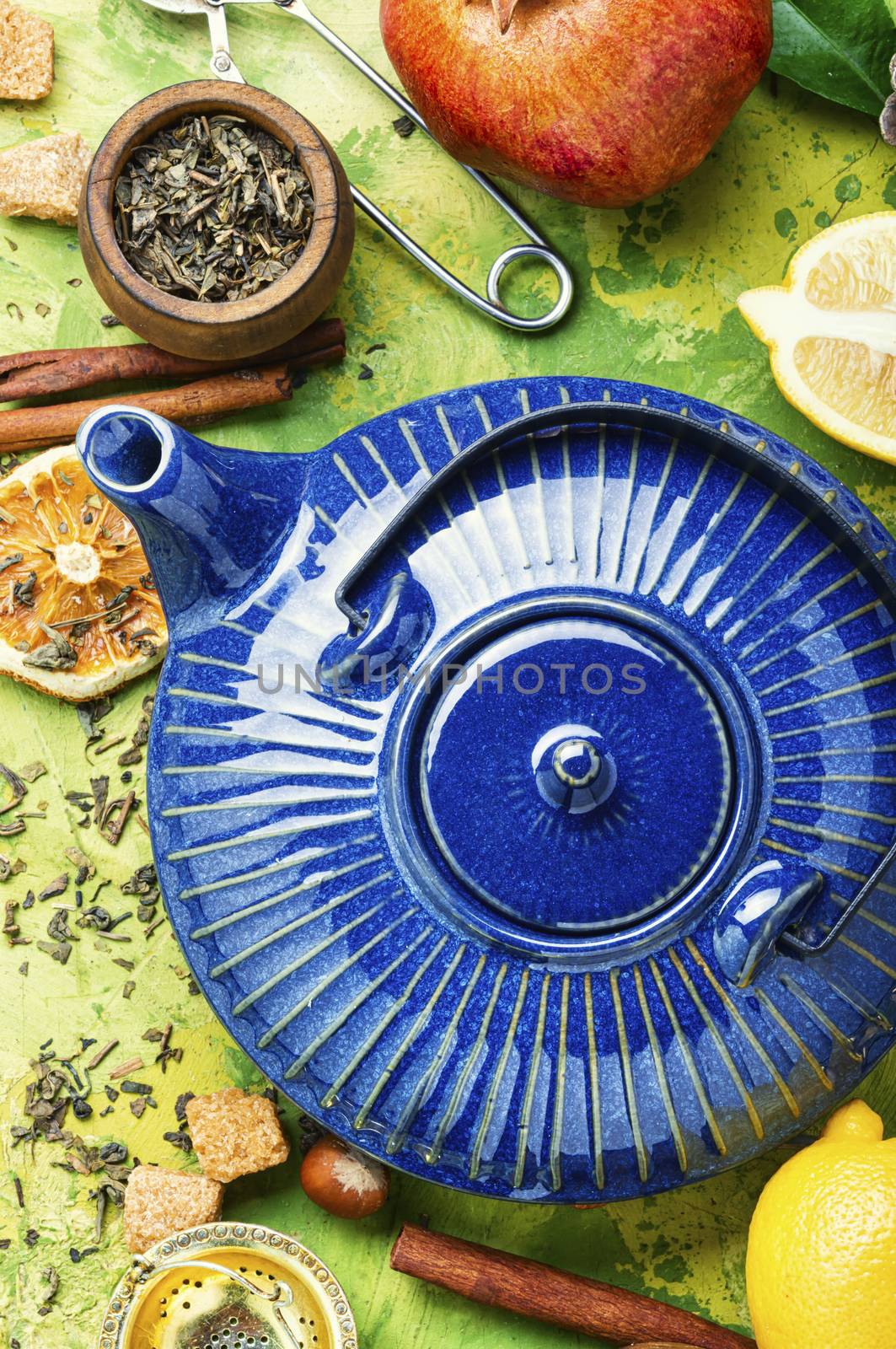 Natural ingredients for tea.Porcelain blue teapot.Useful tea with lemon.Tea time concept.