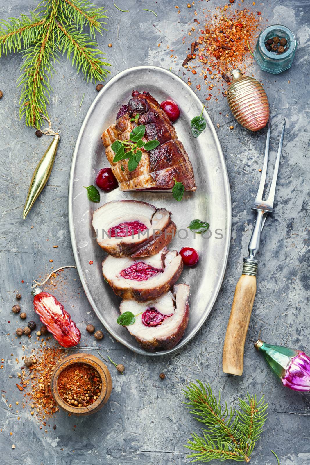 Sliced meatloaf filled with cherries.Christmas dish, festive food