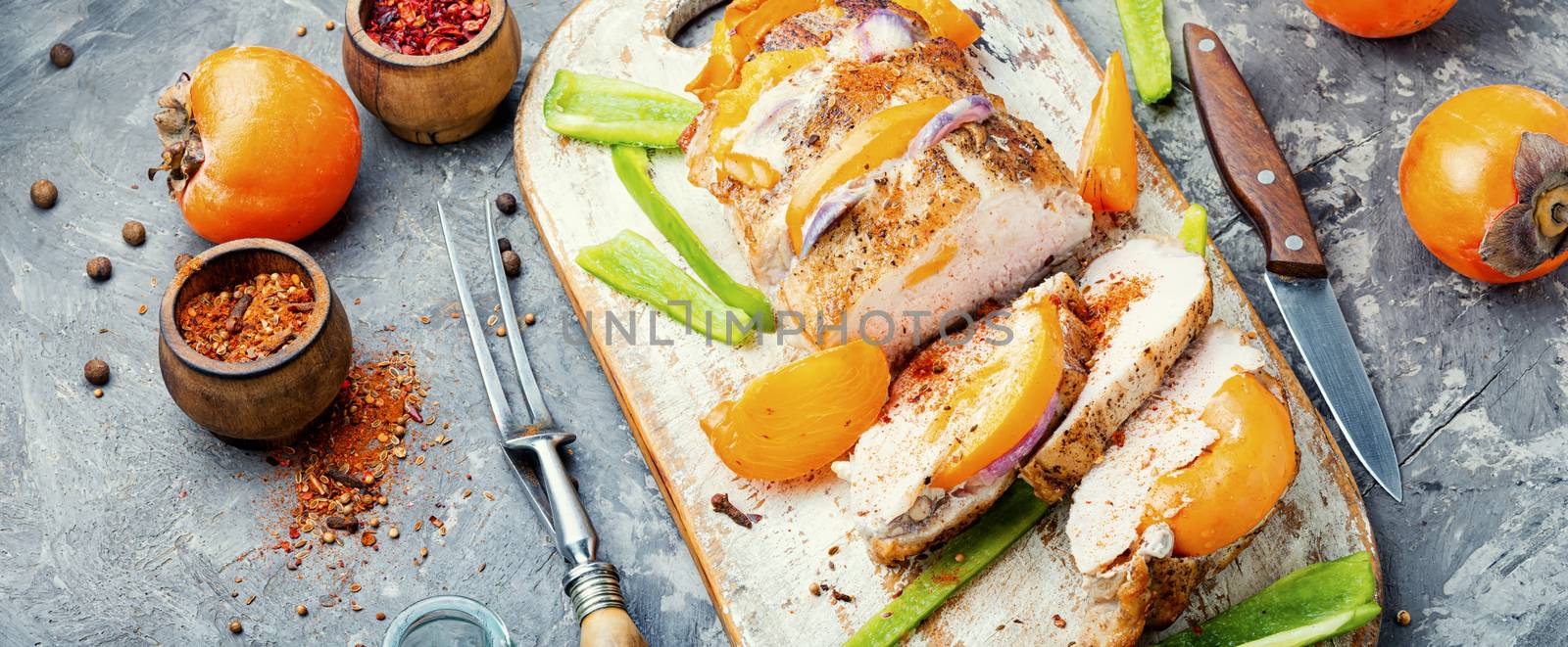 Sliced baked pork with on cutting board