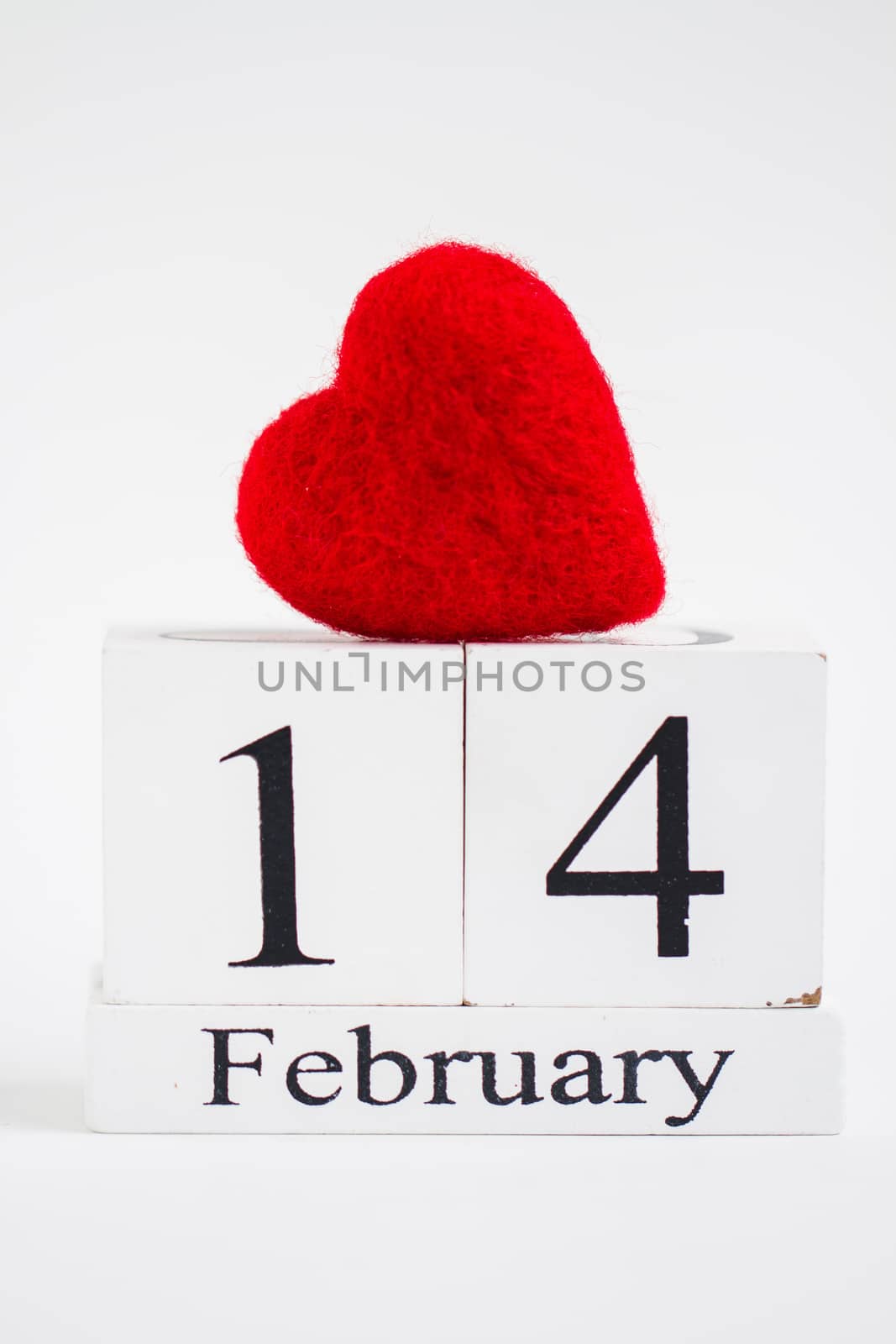 Cube calendar with red heart isolated on white. Valentines day by maggee