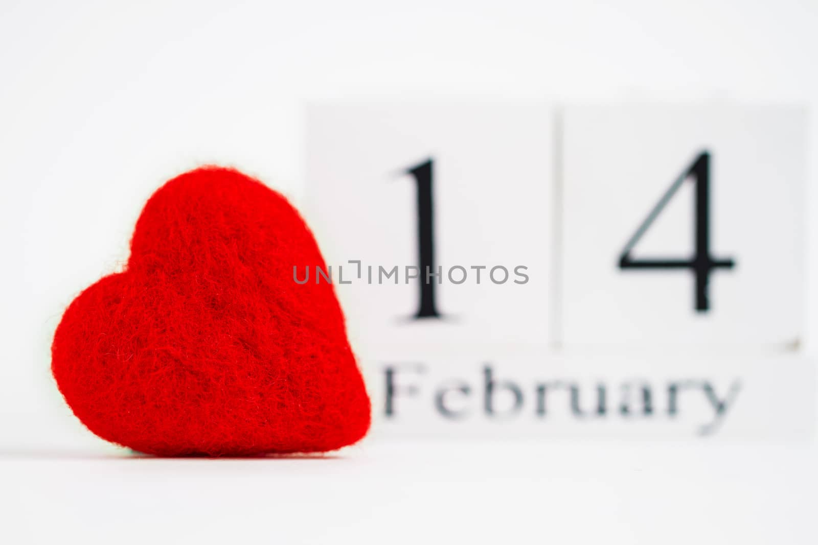 Cube calendar with red heart isolated on white. Valentines day by maggee