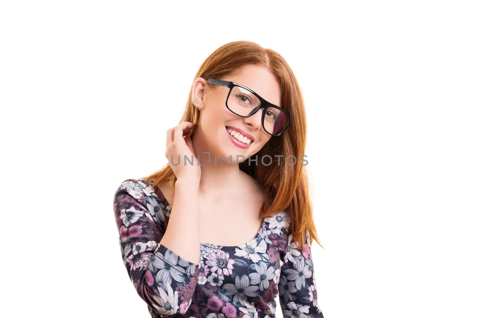 Portrait of a beautiful smiling young hipster girl in colorful casual clothes with glasses, looking timidly into the camera, isolated on white background.