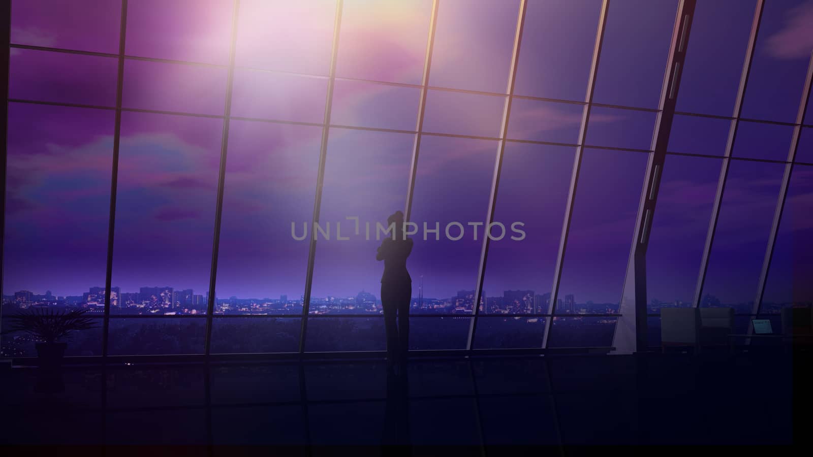 Silhouette of a business woman standing against an office window and looking at the night city.