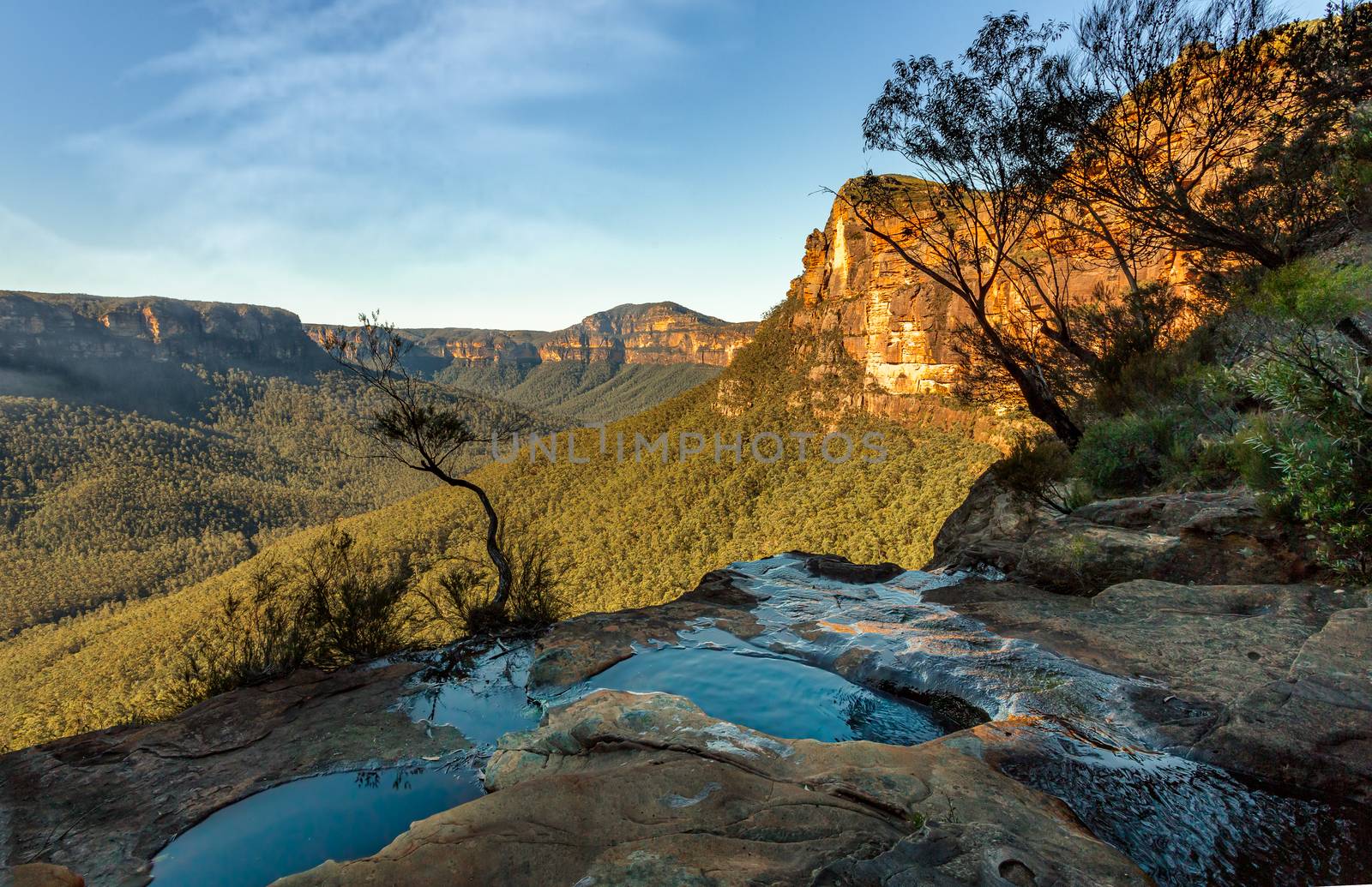 Idyllic views at the end of the canyon where the creek finally makes its way over the cliffs and 70 metres into the valley below.  Location:  Grose Valley