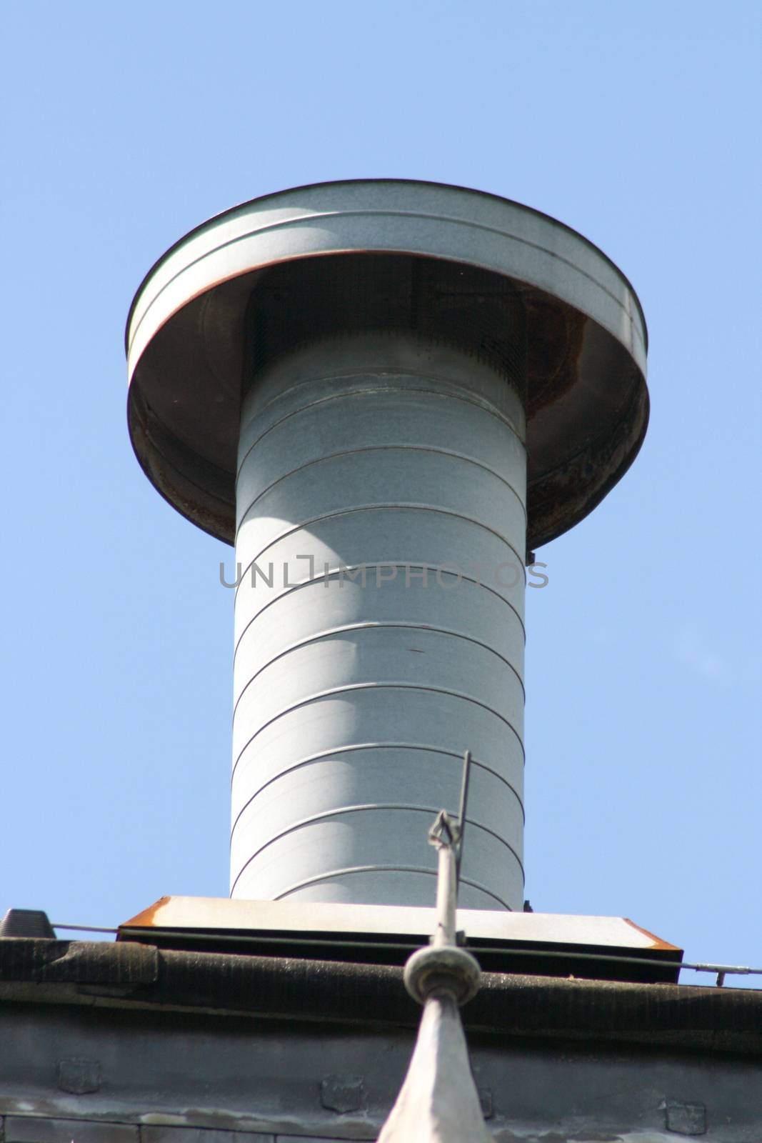 Vent pipe with cover, on top of a building