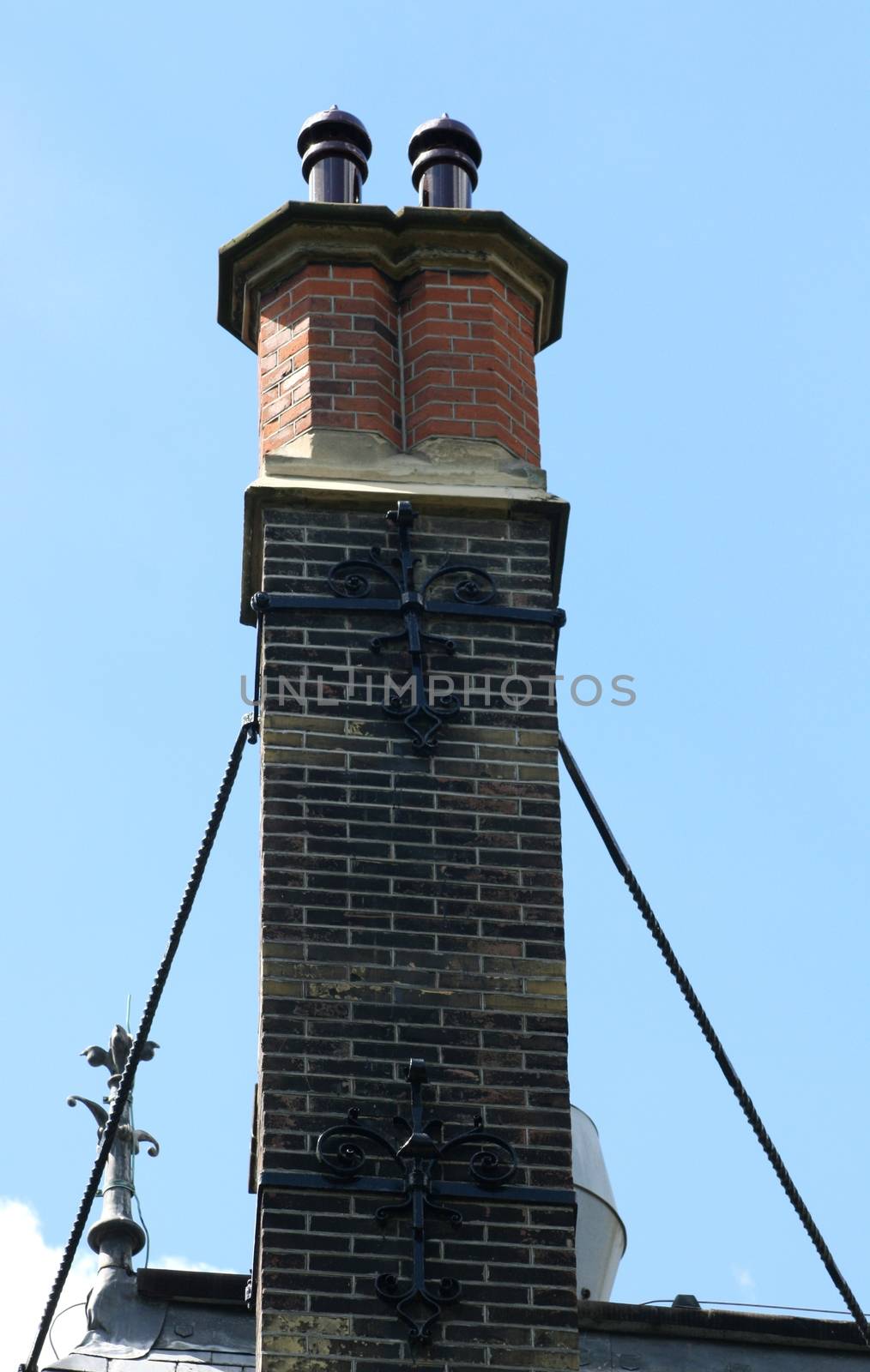 A tall chimney with struts