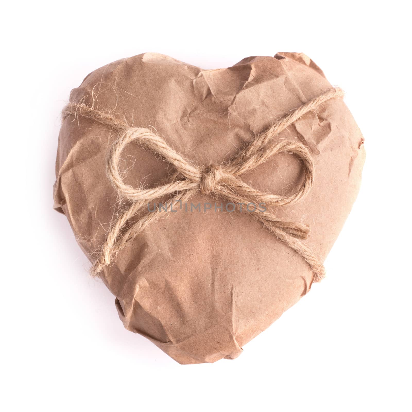 Heart in brown Wrapping Paper tied with rope bow isolated on white background Valentine day surprise concept