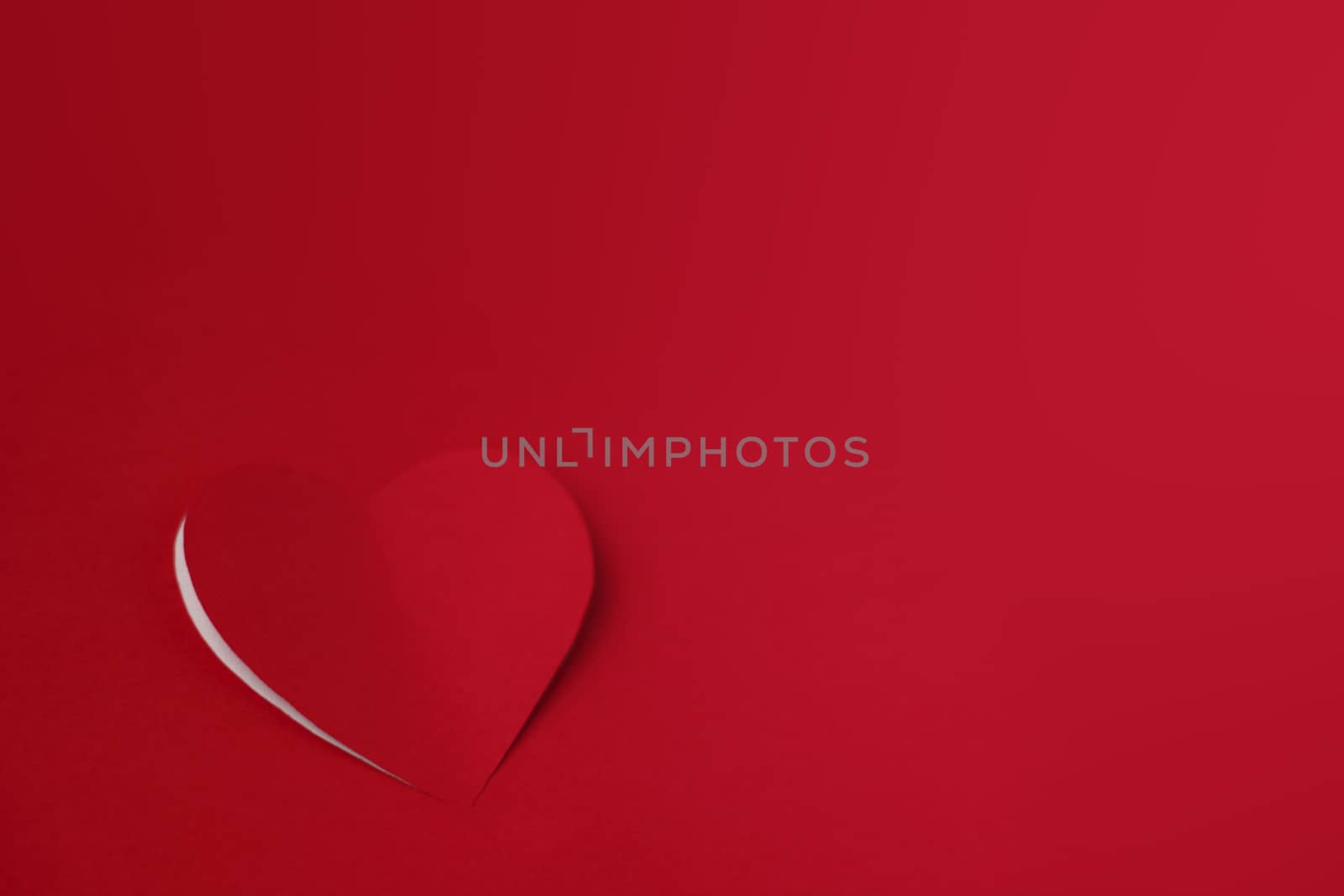 Heart cut from red paper background, Valentines day card