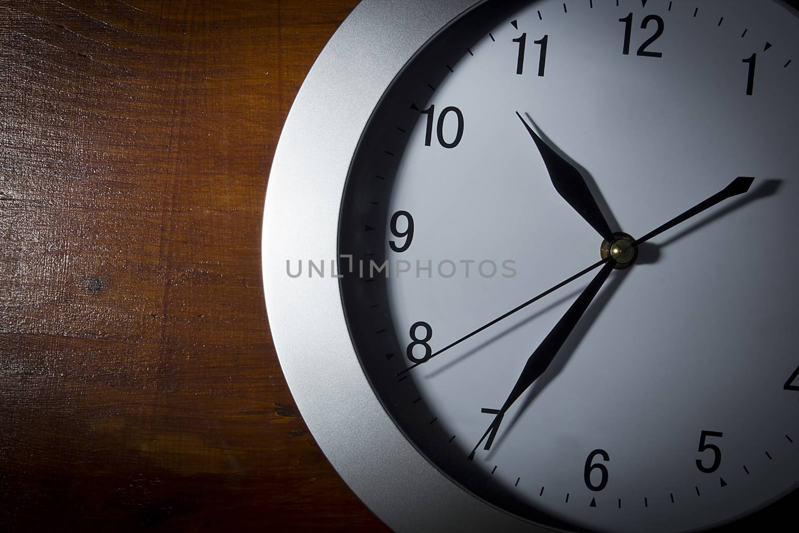 Clock on a wooden table by VIPDesignUSA
