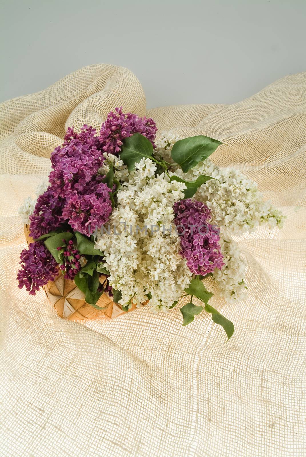 Still life with bouquet of flowers and accessories on a studio background