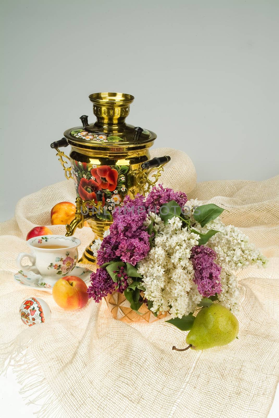 Still life with bouquet of flowers and accessories on a studio background