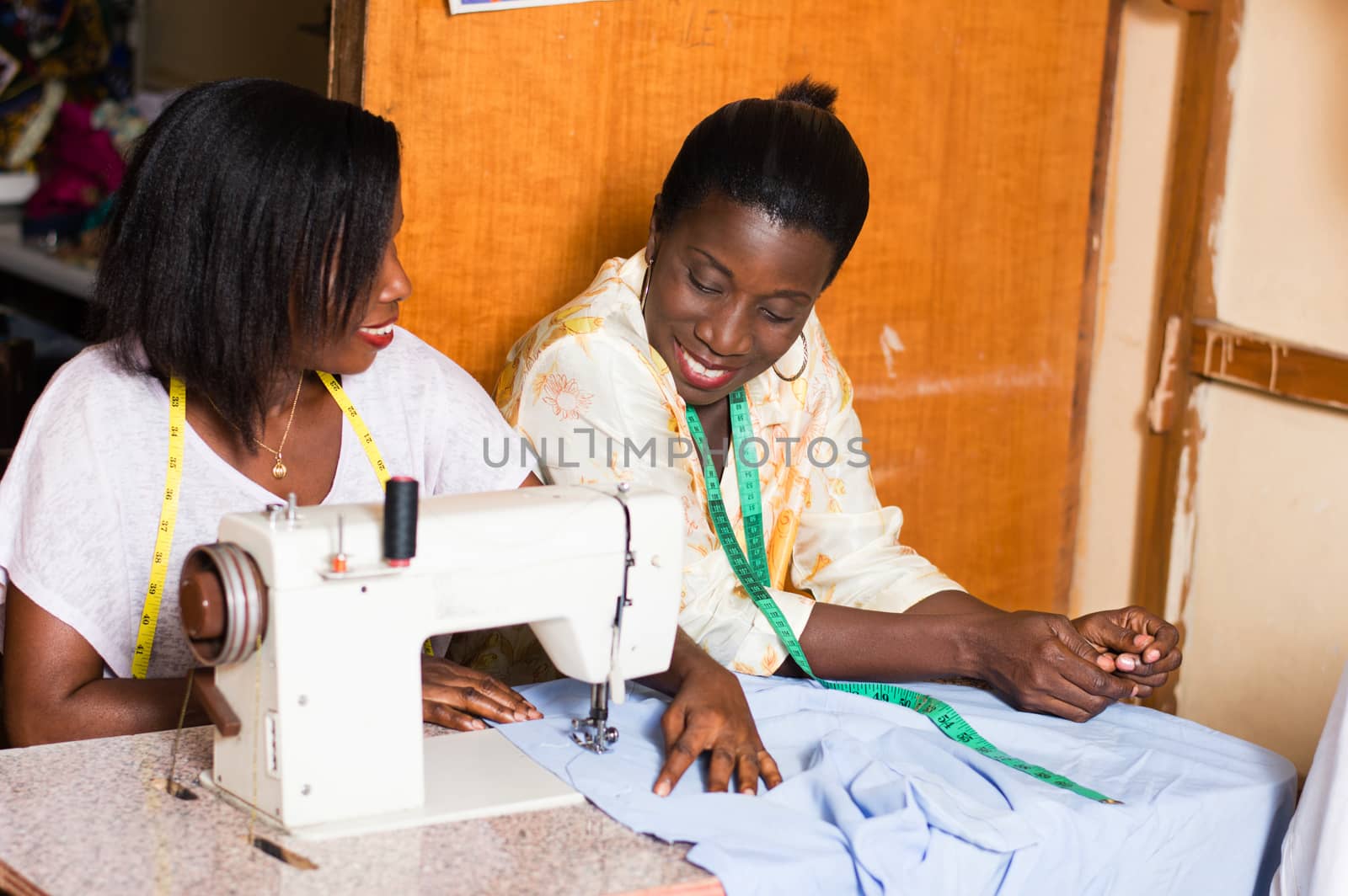 the student is happy to learn sewing and pleases her  teacher.