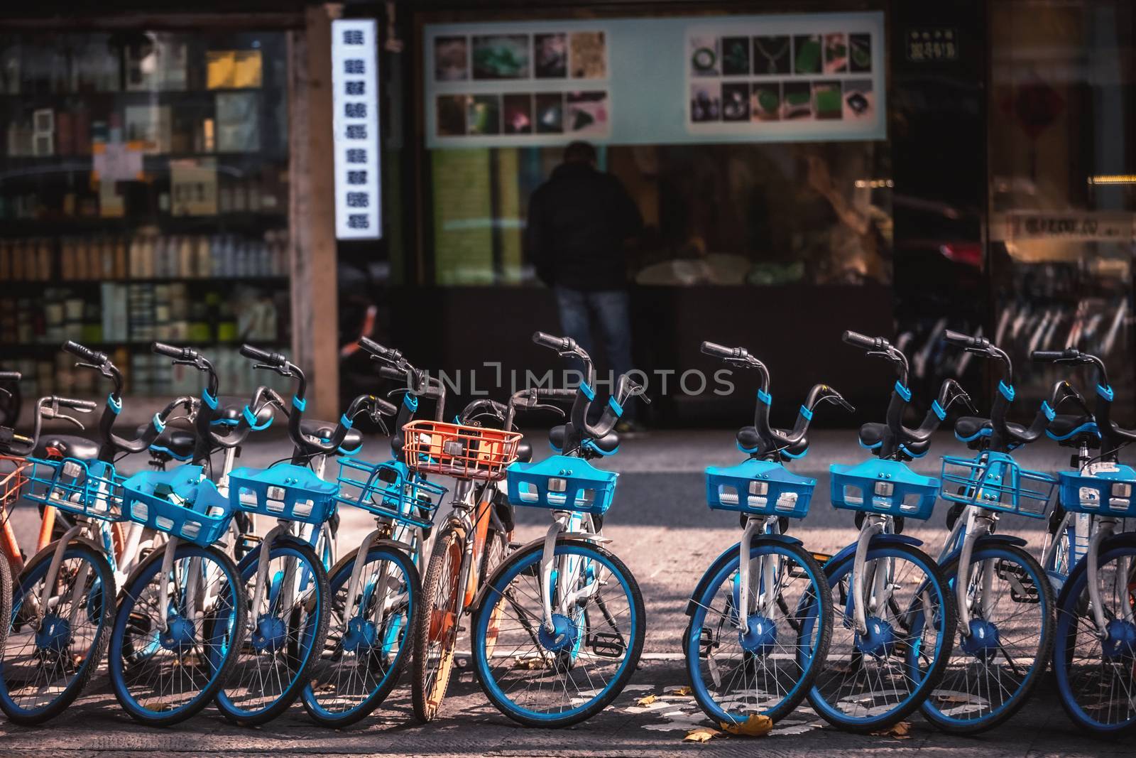 Rental electric bikes parked on the sidewalk, Hangzhou, China