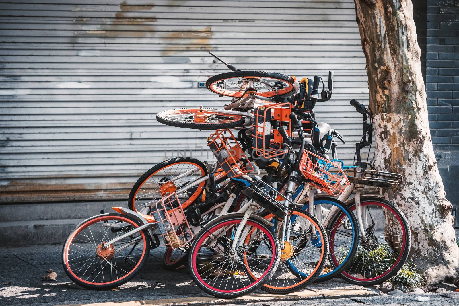 pile of broken electric bikes on the sidewalk, Hangzhou, China
