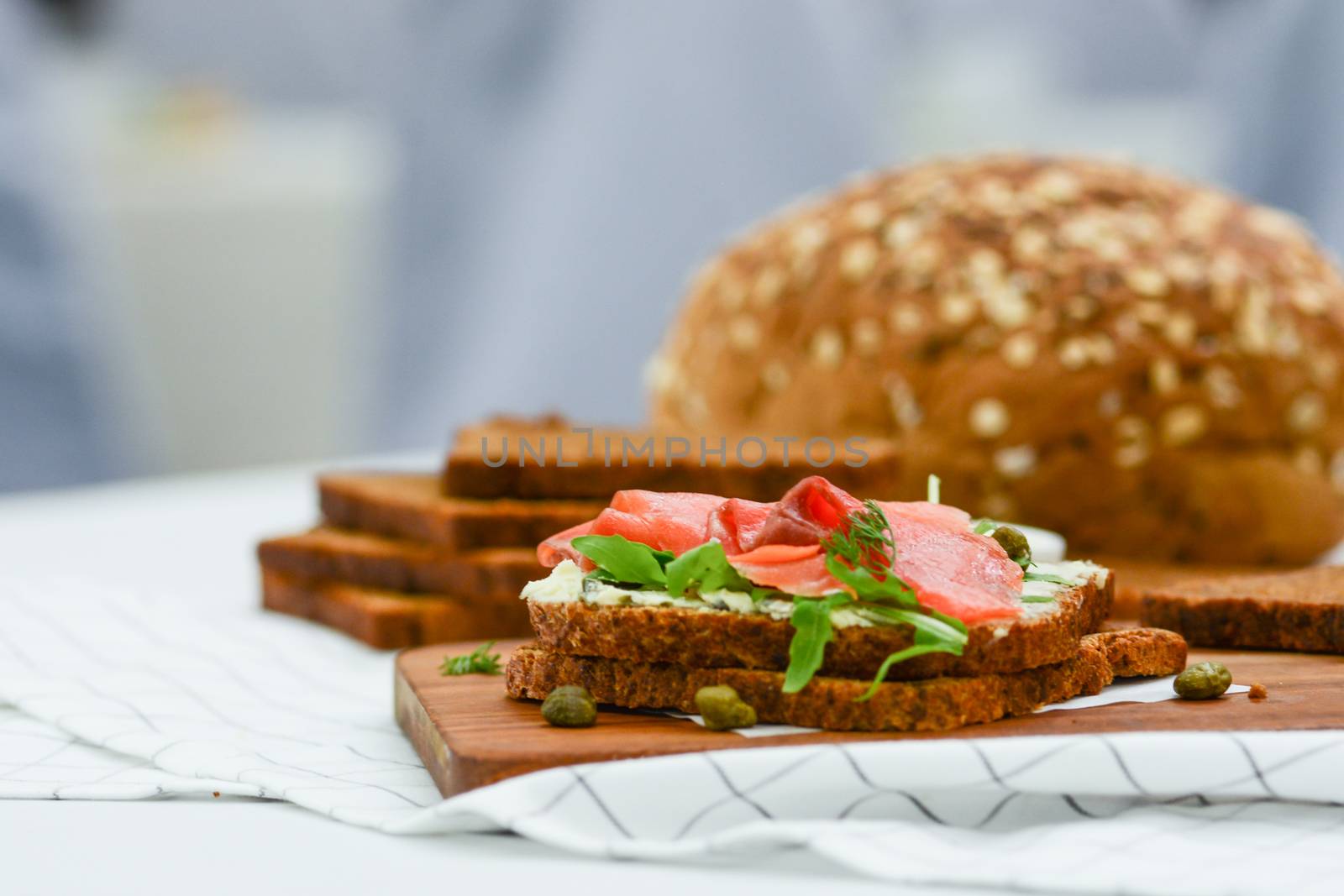 Smoked salmon sandwich with cheese, pistachio and salad leaves,  by yuiyuize