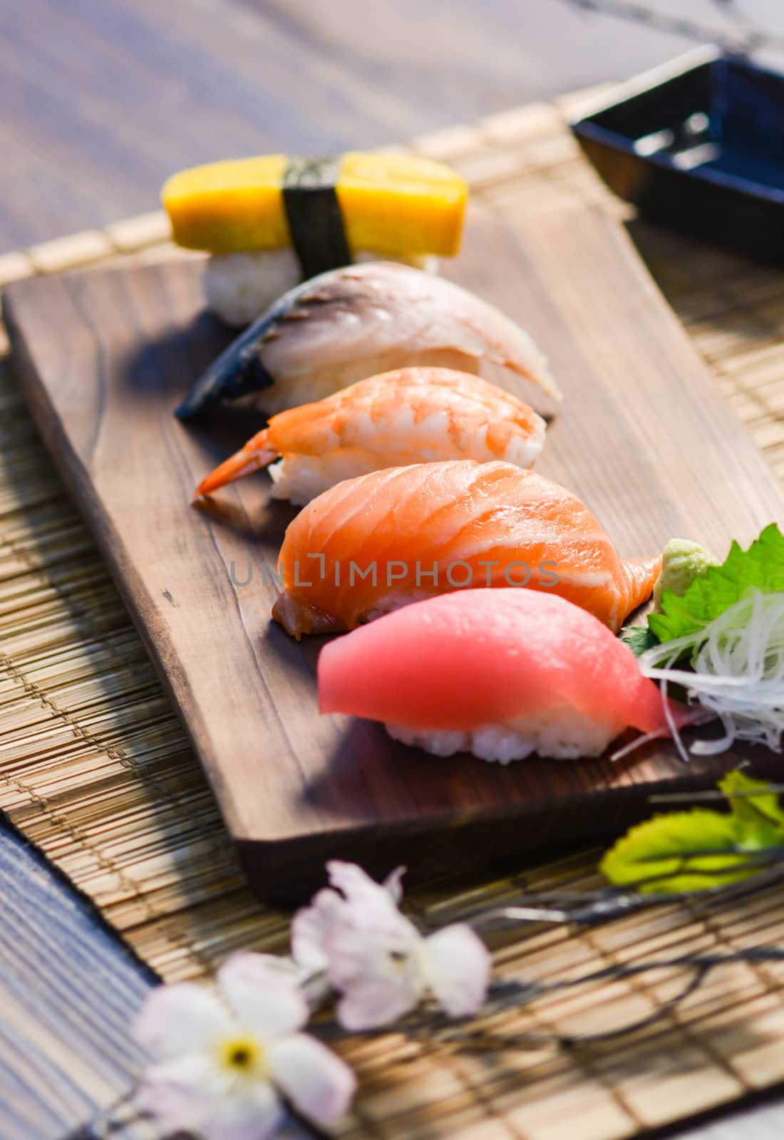 Mix sushi on wood dish, tuna, salmon, sea bass, sweet egg, shrim by yuiyuize