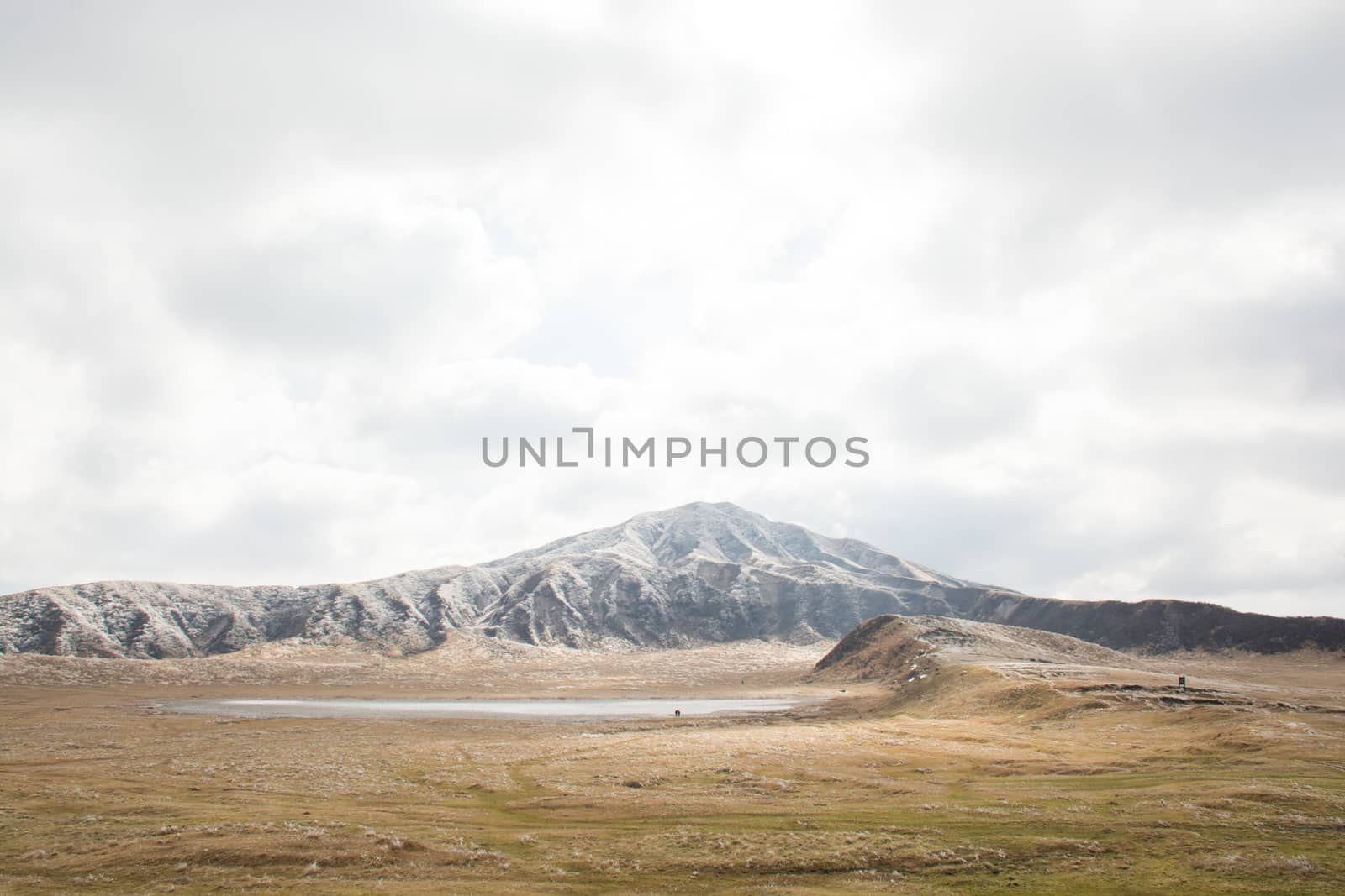 Mount Aso and Kusasenri in winter. covered by golden yellow grassland - Kumamoto, Japan