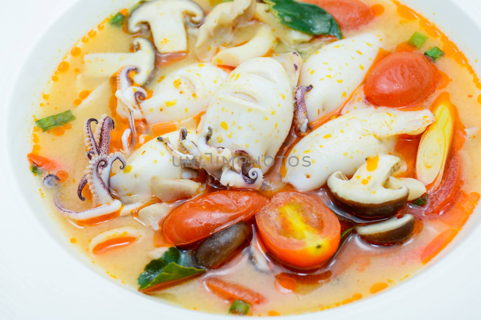 Squids and lemon grass spicy soup with mushrooms, tomatoes and h by yuiyuize