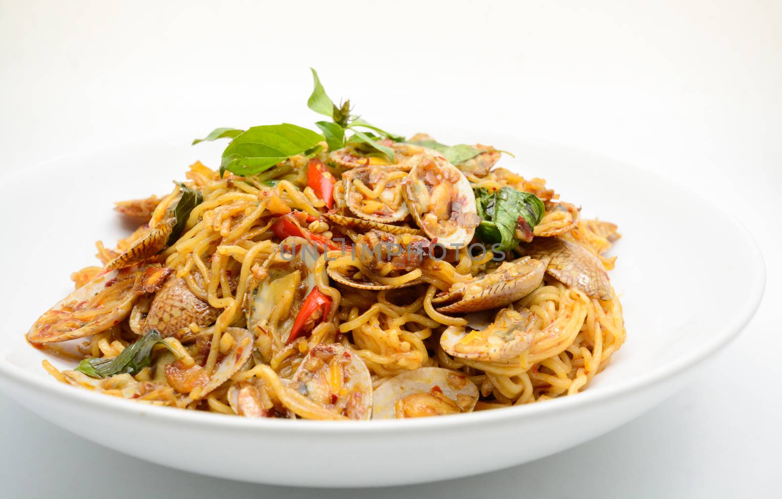 Stir fried noodles with clams and herbs, hot and spicy dish by yuiyuize