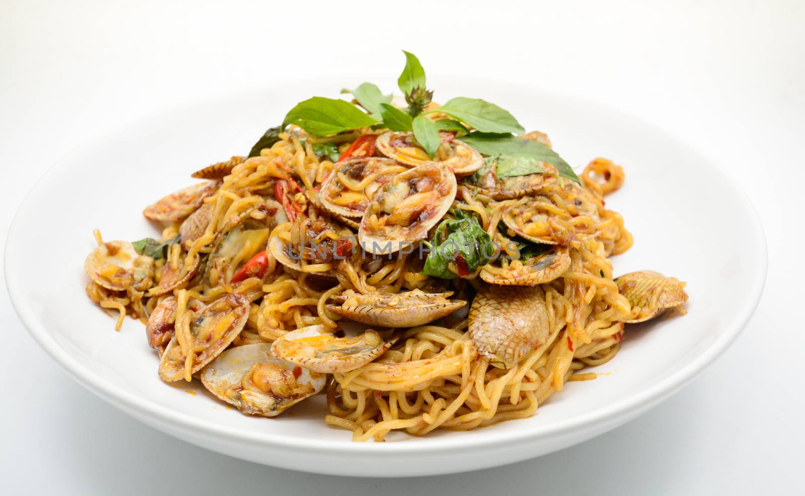 Stir fried noodles with clams and herbs, hot and spicy dish by yuiyuize