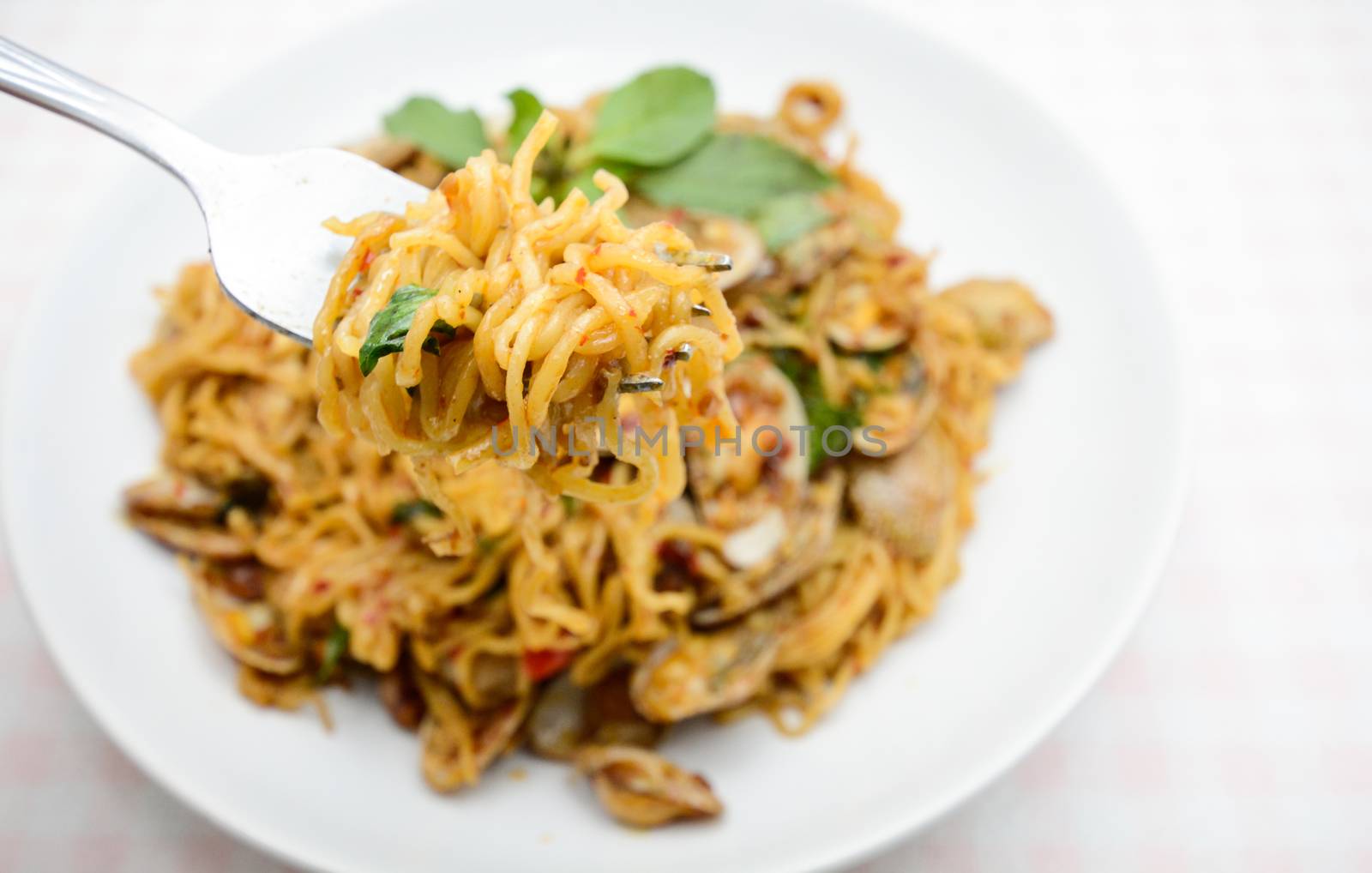 Stir fried noodles with clams and herbs, hot and spicy dish by yuiyuize