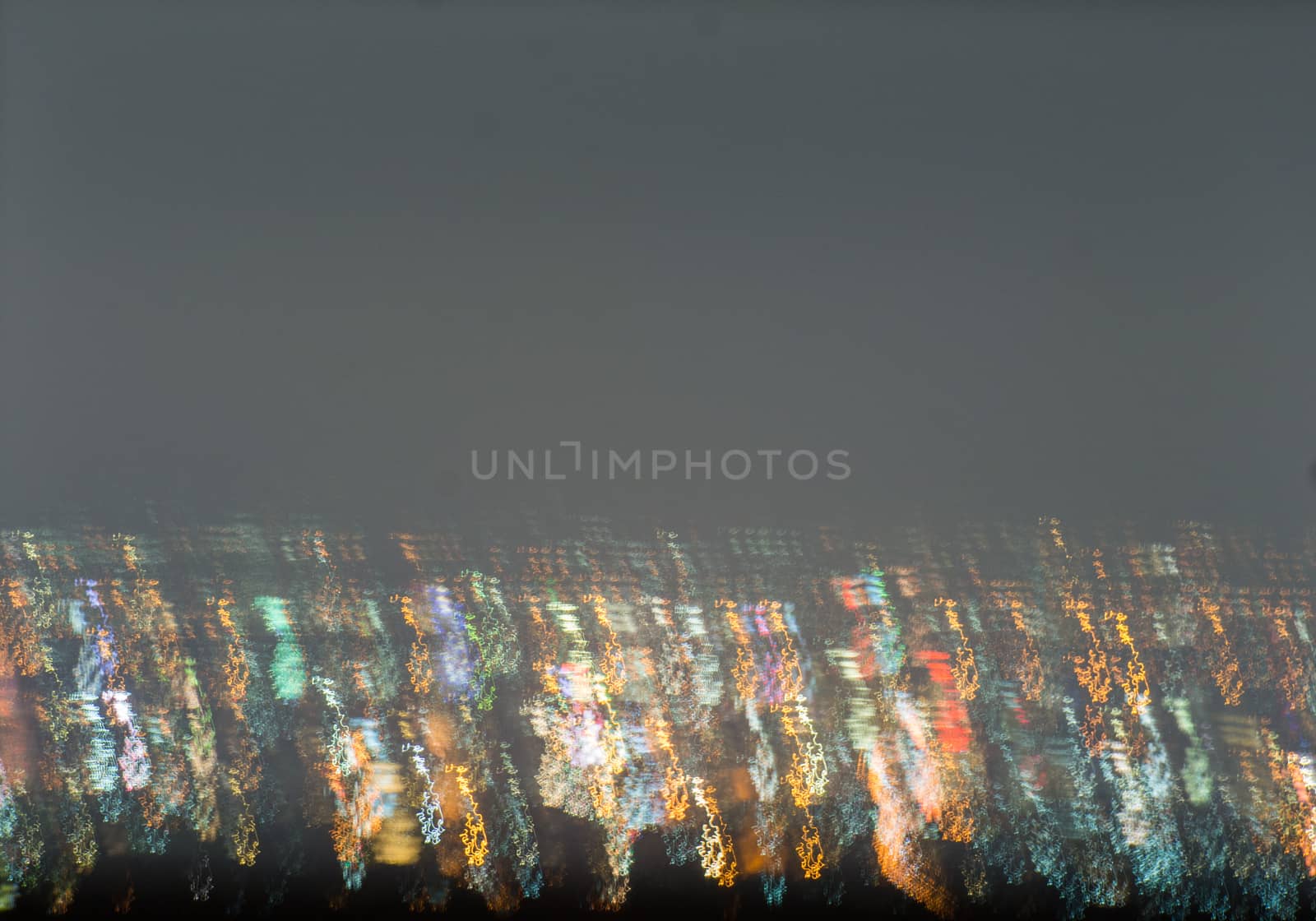 Abstract long exposure, experimental surreal photo, city and vehicle lights at night
