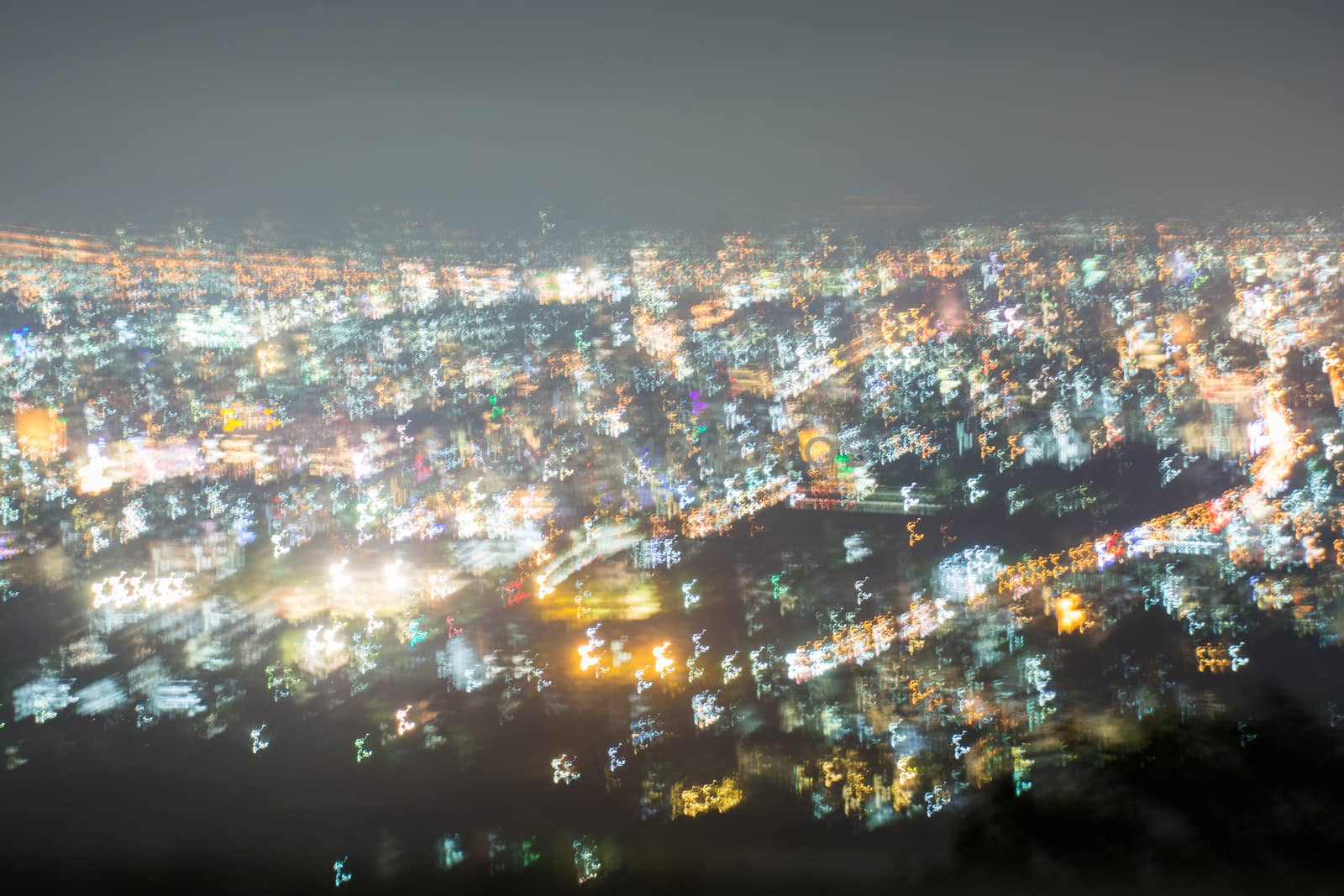 Abstract long exposure, experimental surreal photo, city and vehicle lights at night
