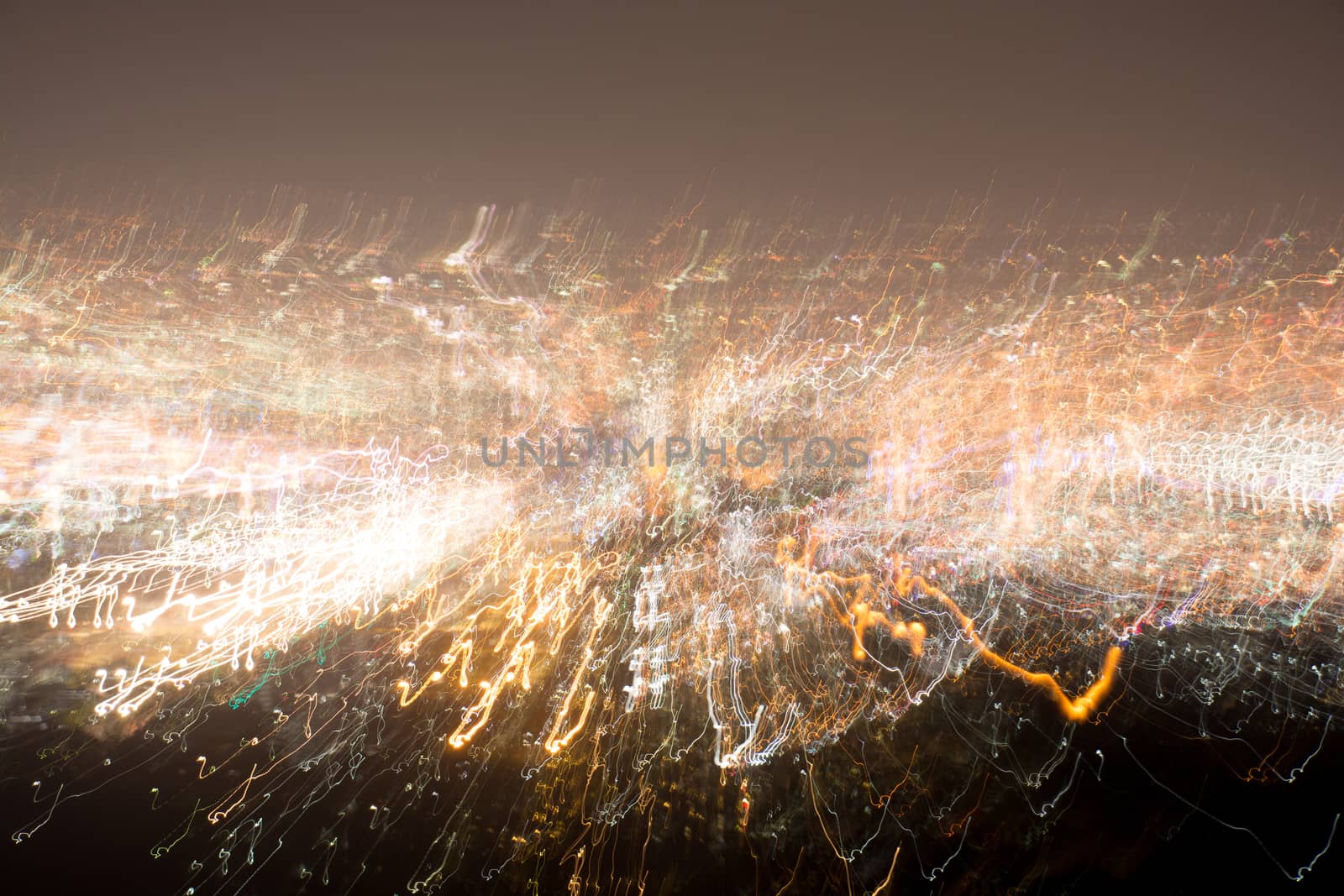 Abstract long exposure, experimental surreal photo, city and vehicle lights at night
