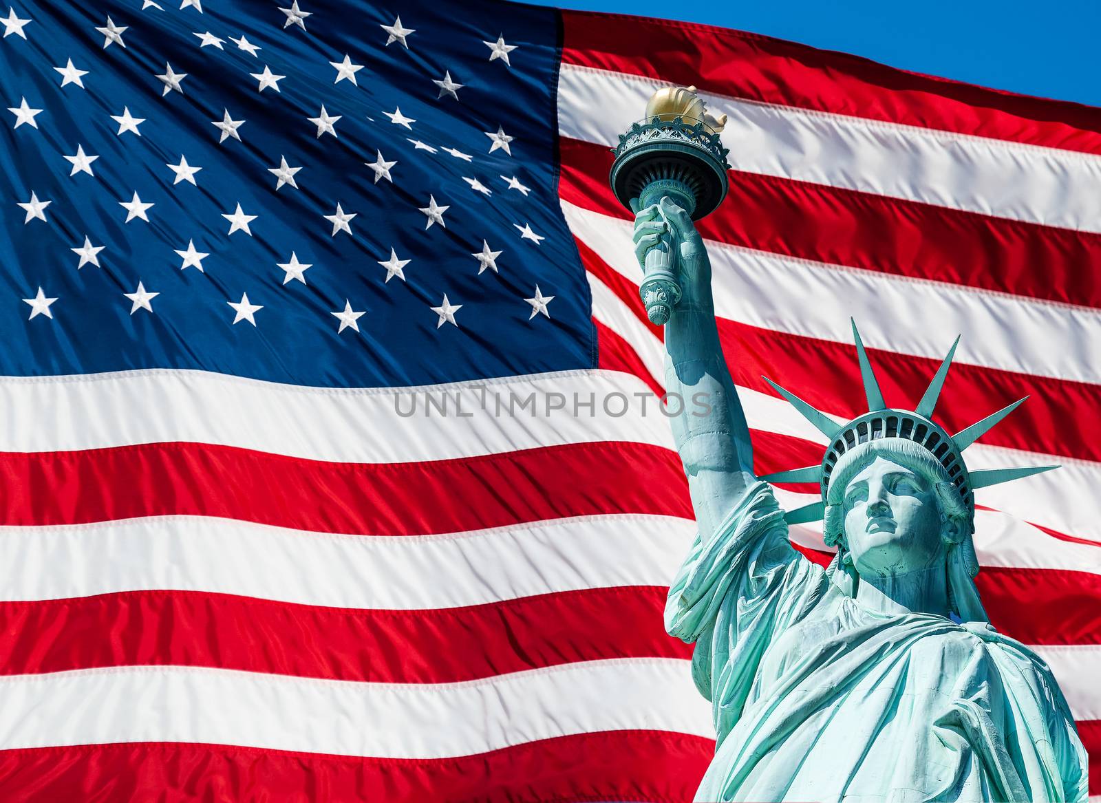 Statue of Liberty at New York City and US Flag