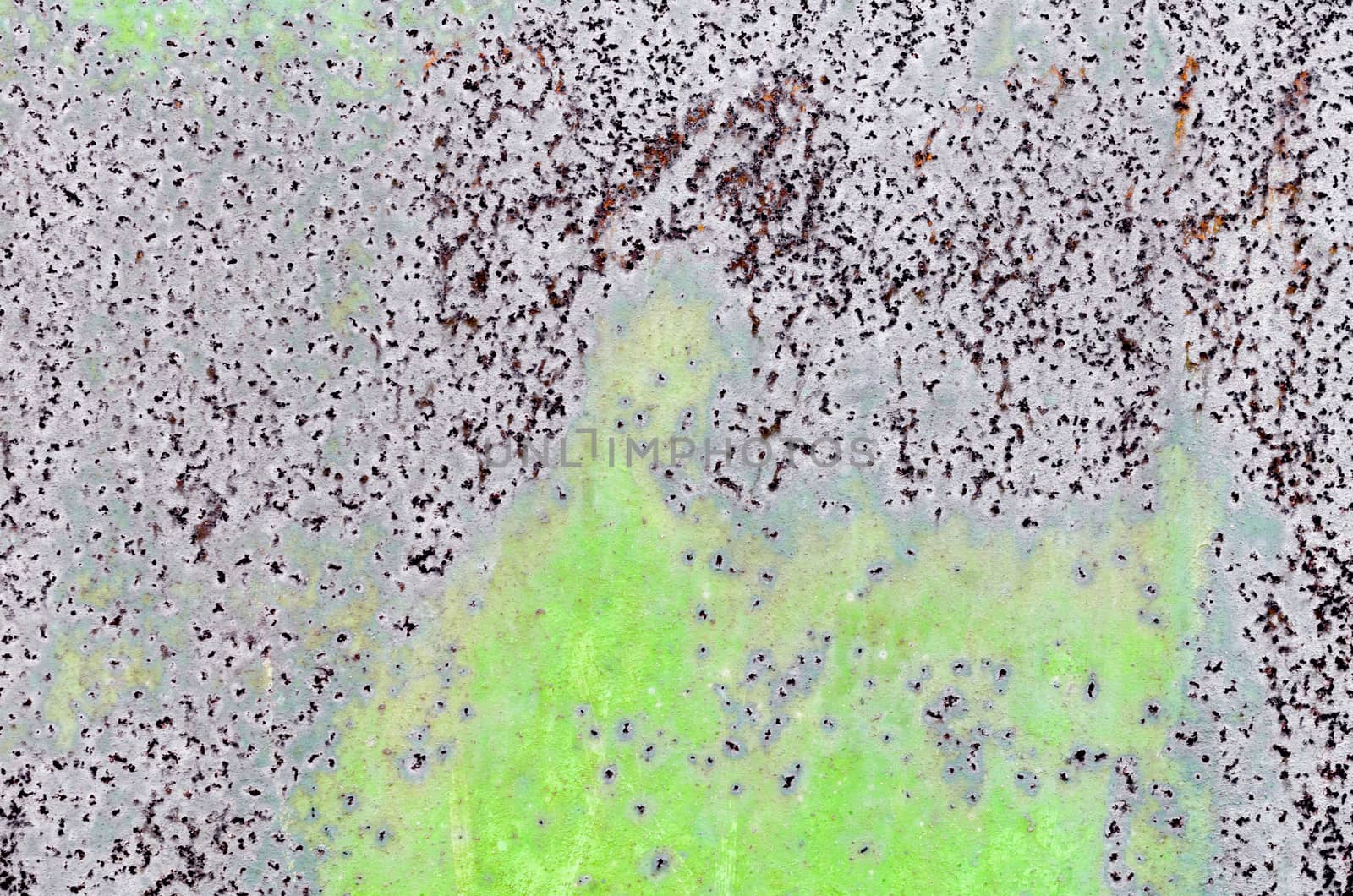 background texture pattern of old rusty iron wall with green paint close up