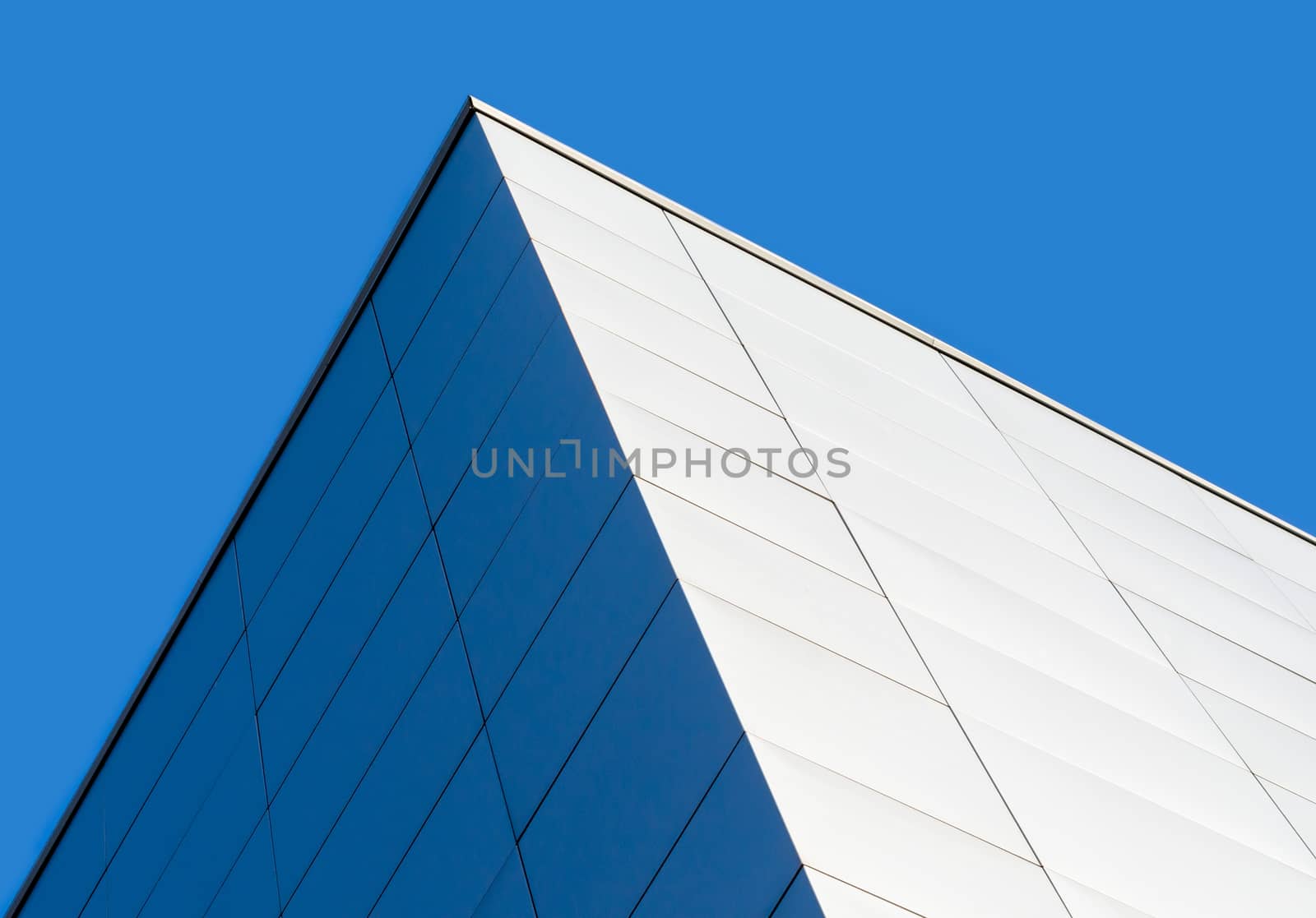 fragment corner of a modern building on a blue background isolated