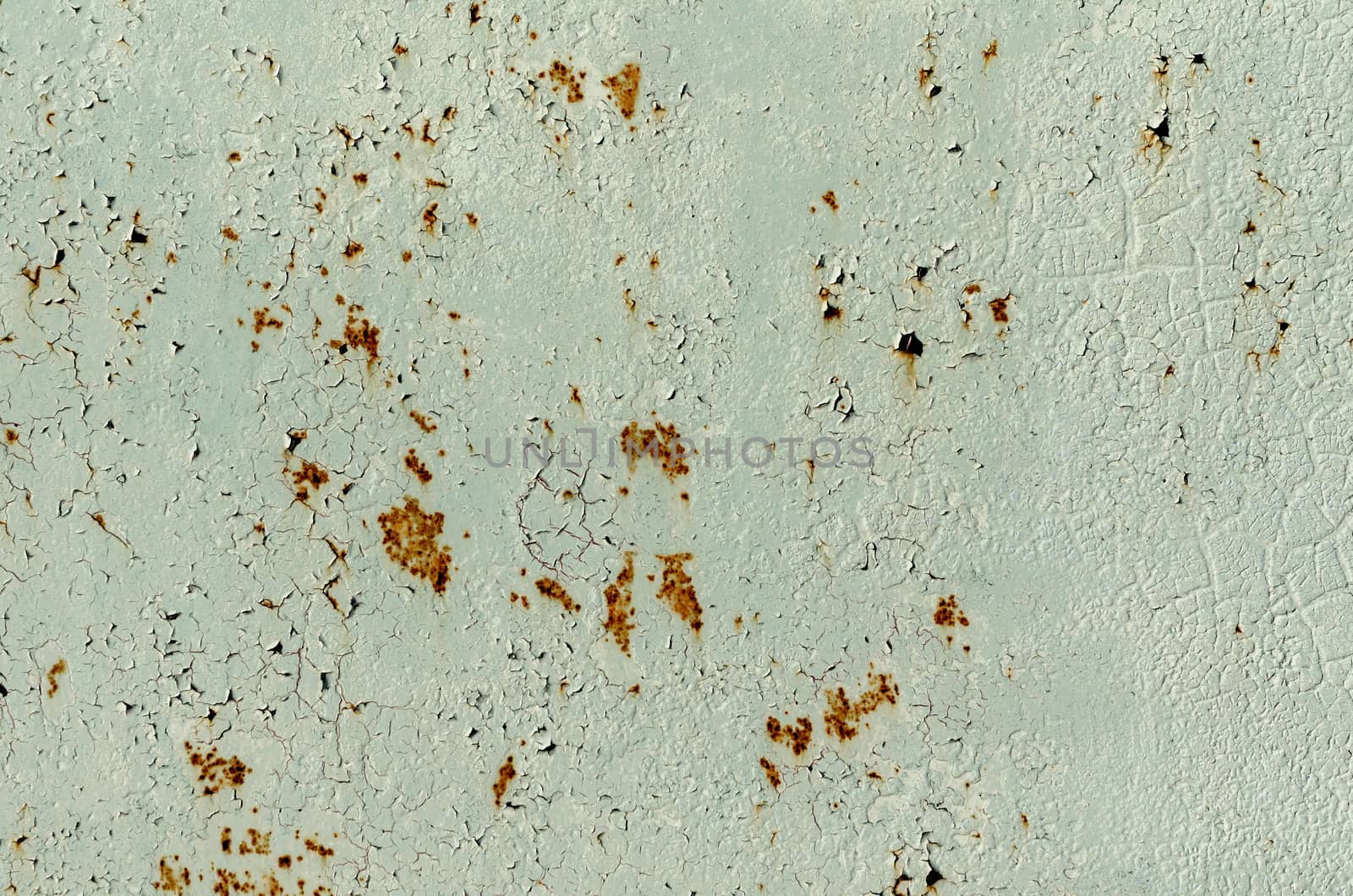 background texture pattern of old rusty iron wall with green paint close up