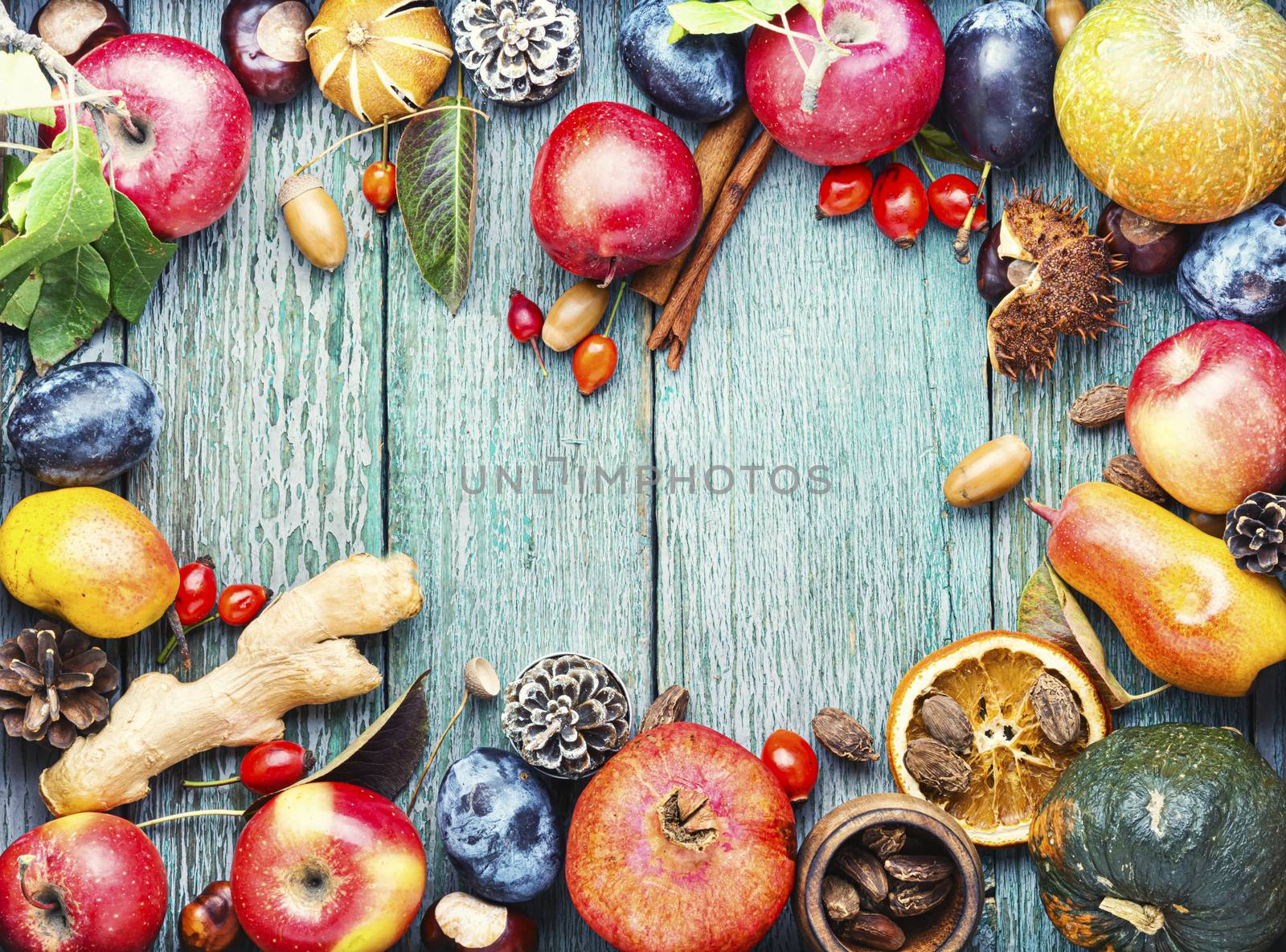 Fruits and pumpkins,nut in autumn still life on wooden table.Autumn background.Autumn harvest