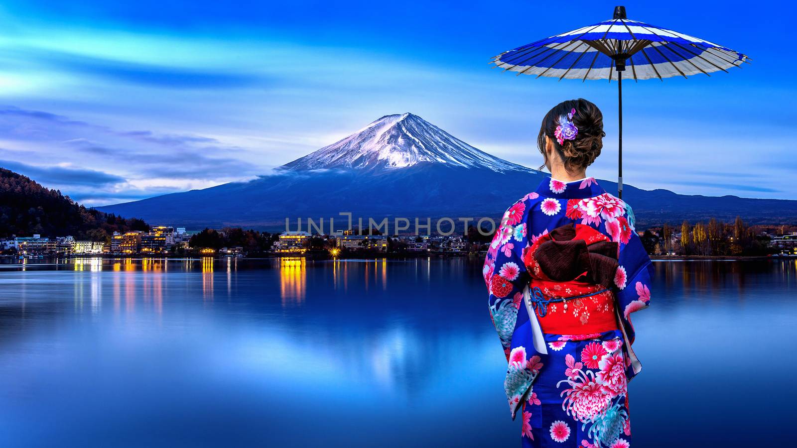 Asian woman wearing japanese traditional kimono at Fuji mountain, Kawaguchiko lake in Japan.