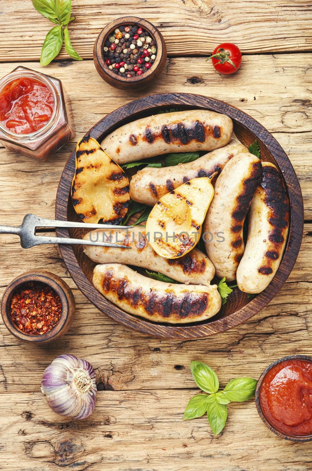 Grilled sausages fried with pear and.Autumn food.Bbq food