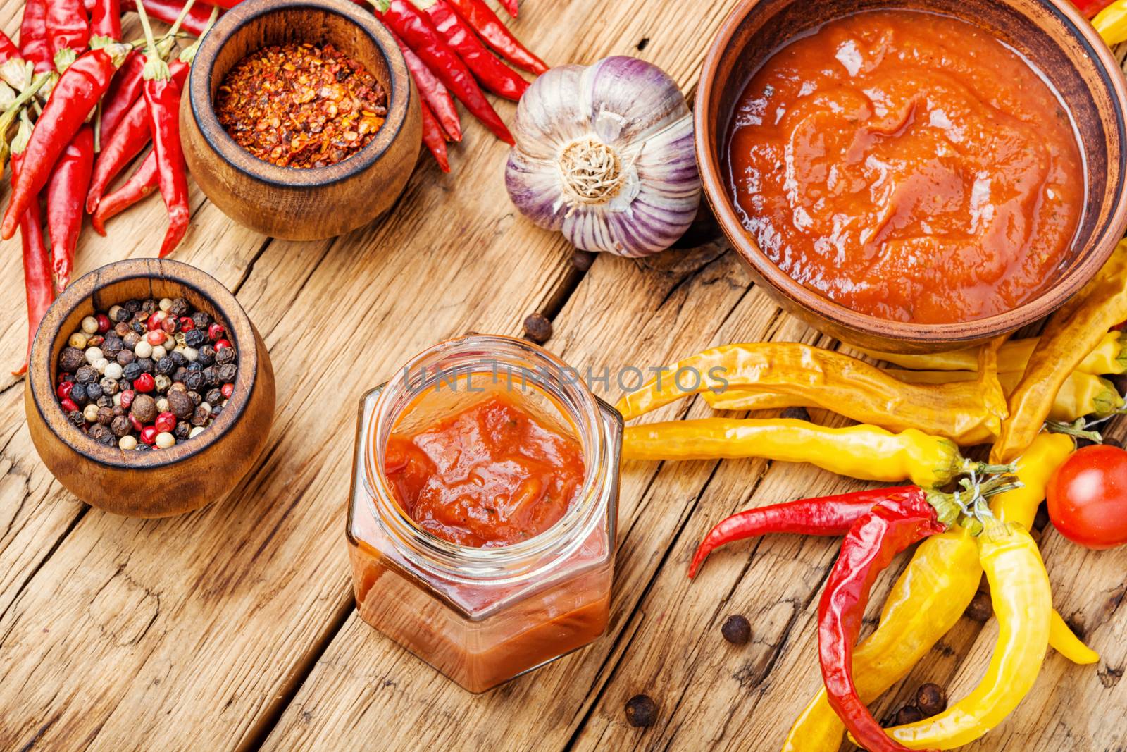 Red chili peppers and chili sauce.Chilli sauce with ingredients