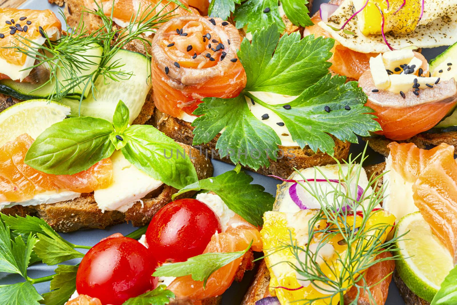 Appetizing bruschetta.Traditional italian bruschetta.Open sandwich with salmon and vegetables