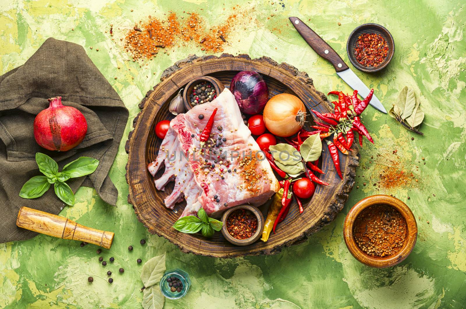 Ribs and pork chops uncooked.Fresh,raw meat and spices.Flat lay