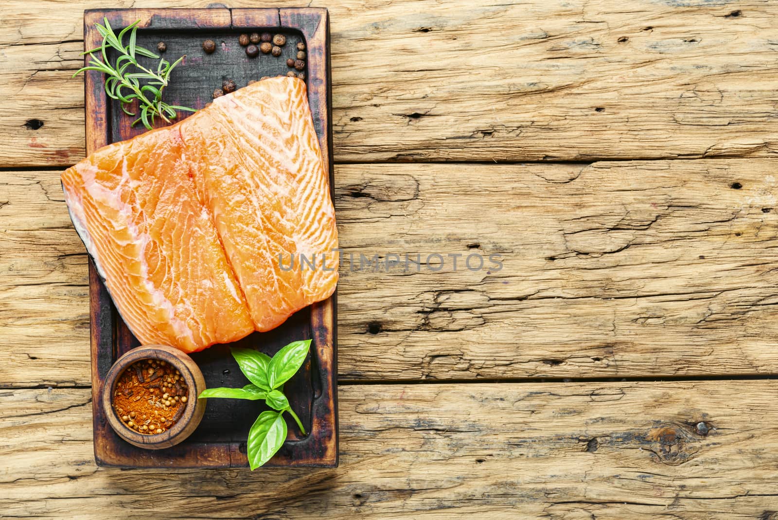 Raw salmon.Fresh salmon fillet on wooden cutting board