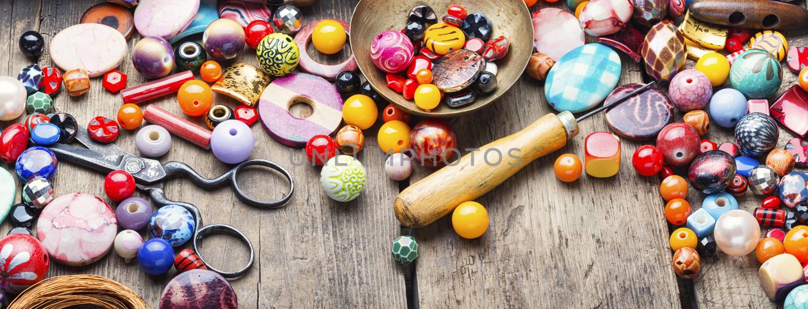 Different beads for making women's jewelry.Bright colored beads