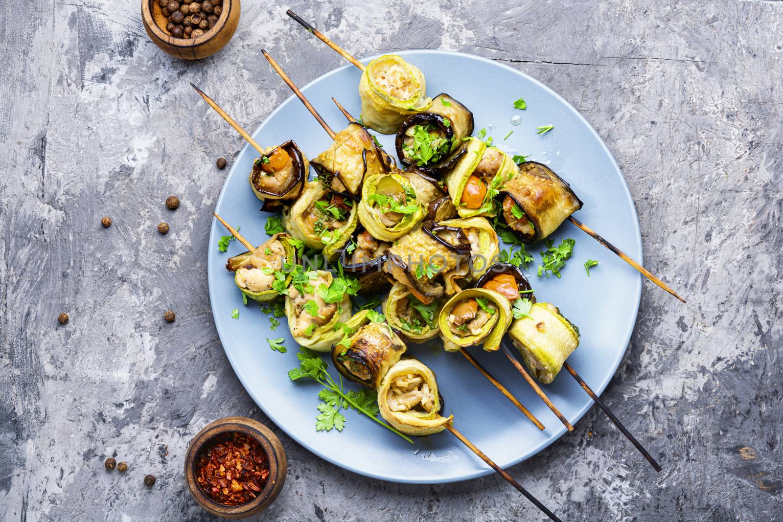 Eggplant and zucchini stuffed with meat on skewers