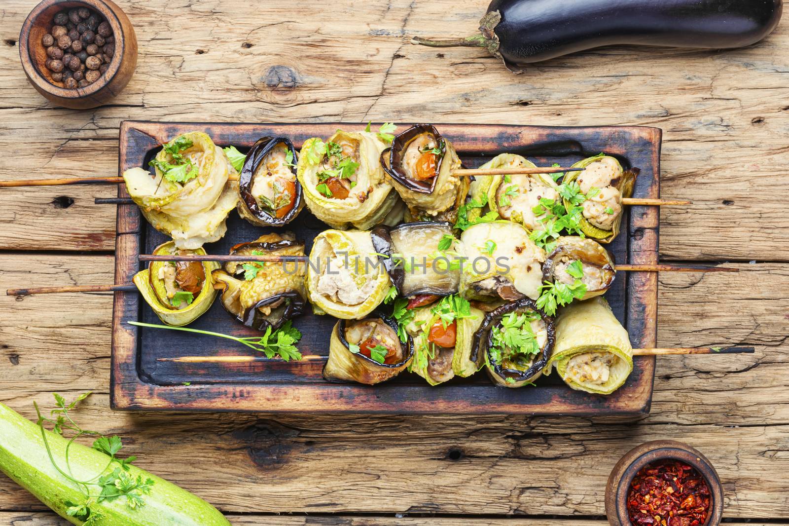 Eggplant and zucchini stuffed with meat on skewers.Grill menu