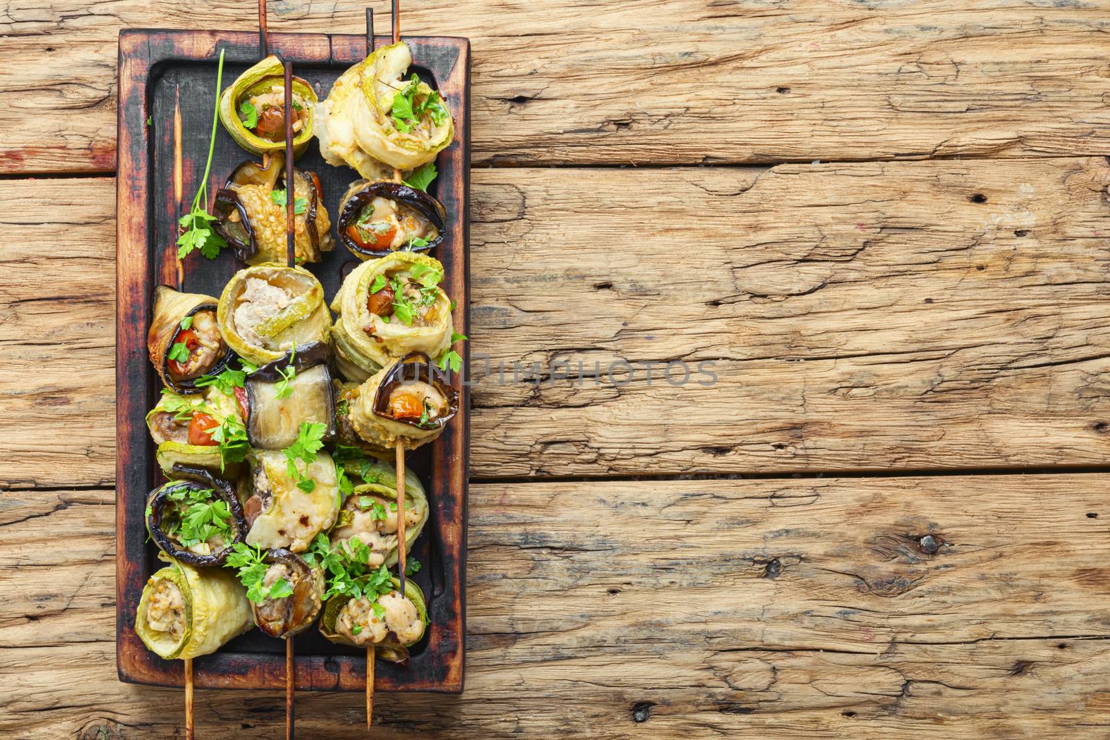 Eggplant and zucchini stuffed with meat on skewers.Grill menu