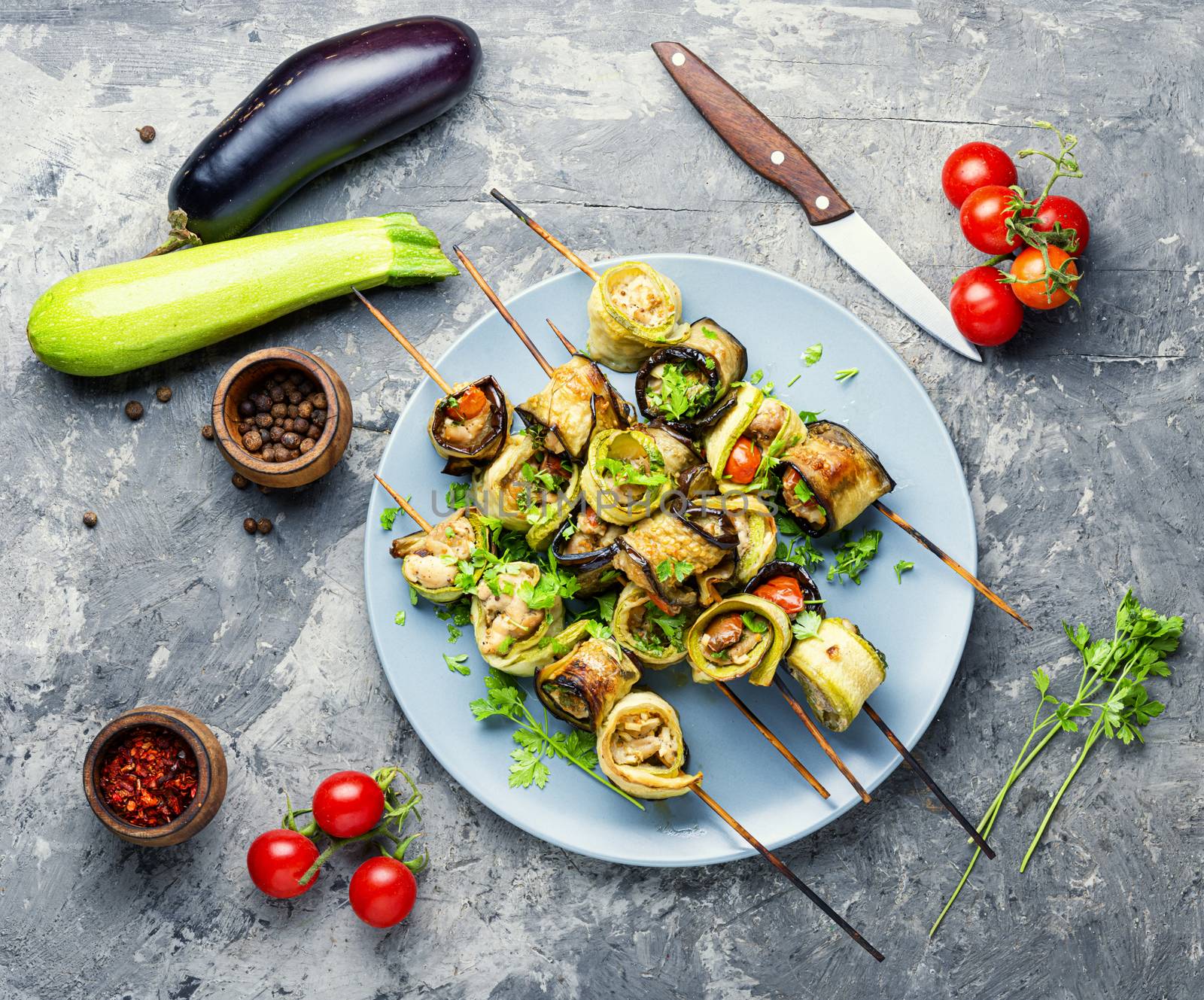 Eggplant and zucchini stuffed with meat on skewers.Flat lay.Vegetarian skewers