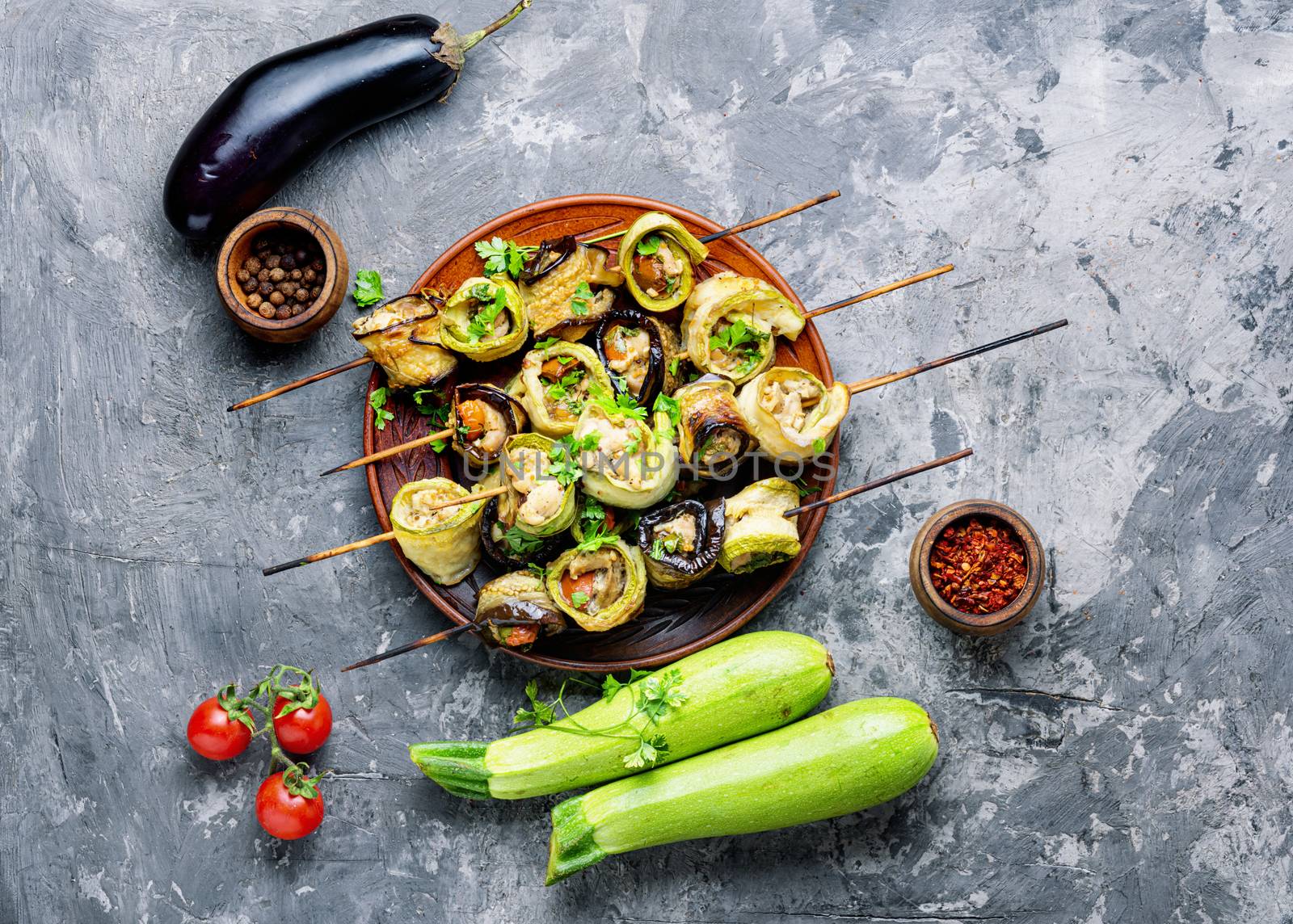 Eggplant and zucchini stuffed with meat on skewers.Flat lay.Vegetarian skewers