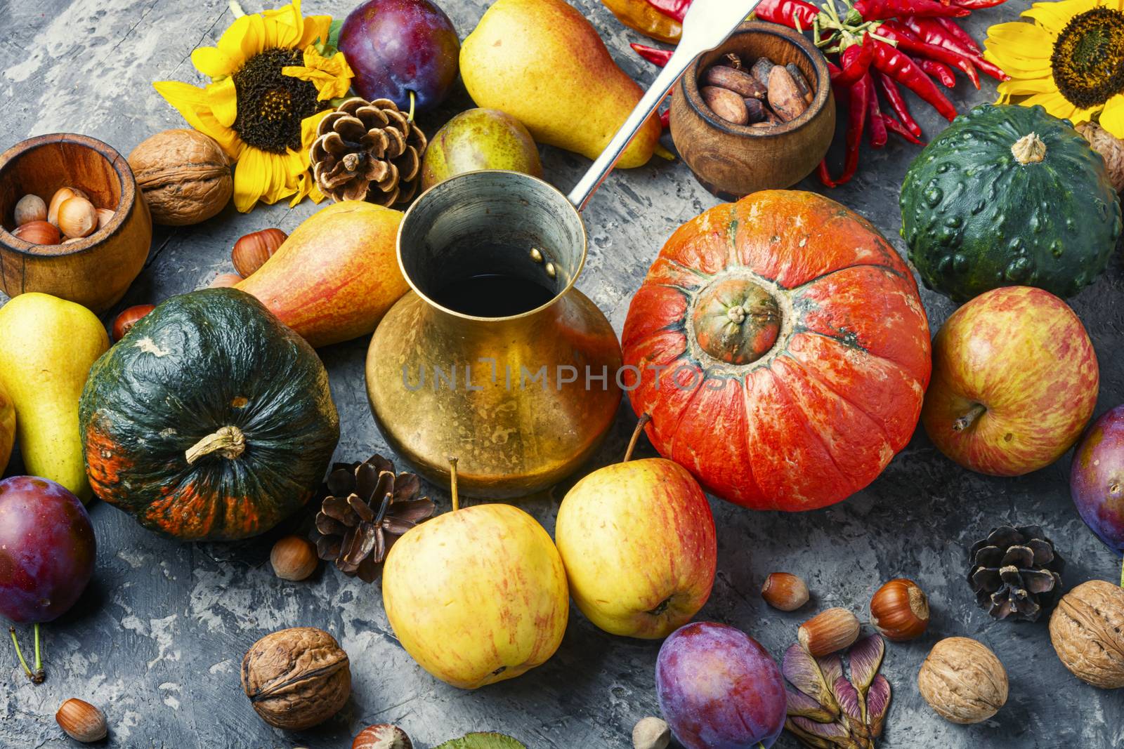Autumn composing with pumpkin, fruit and fall leaves.Fall still life