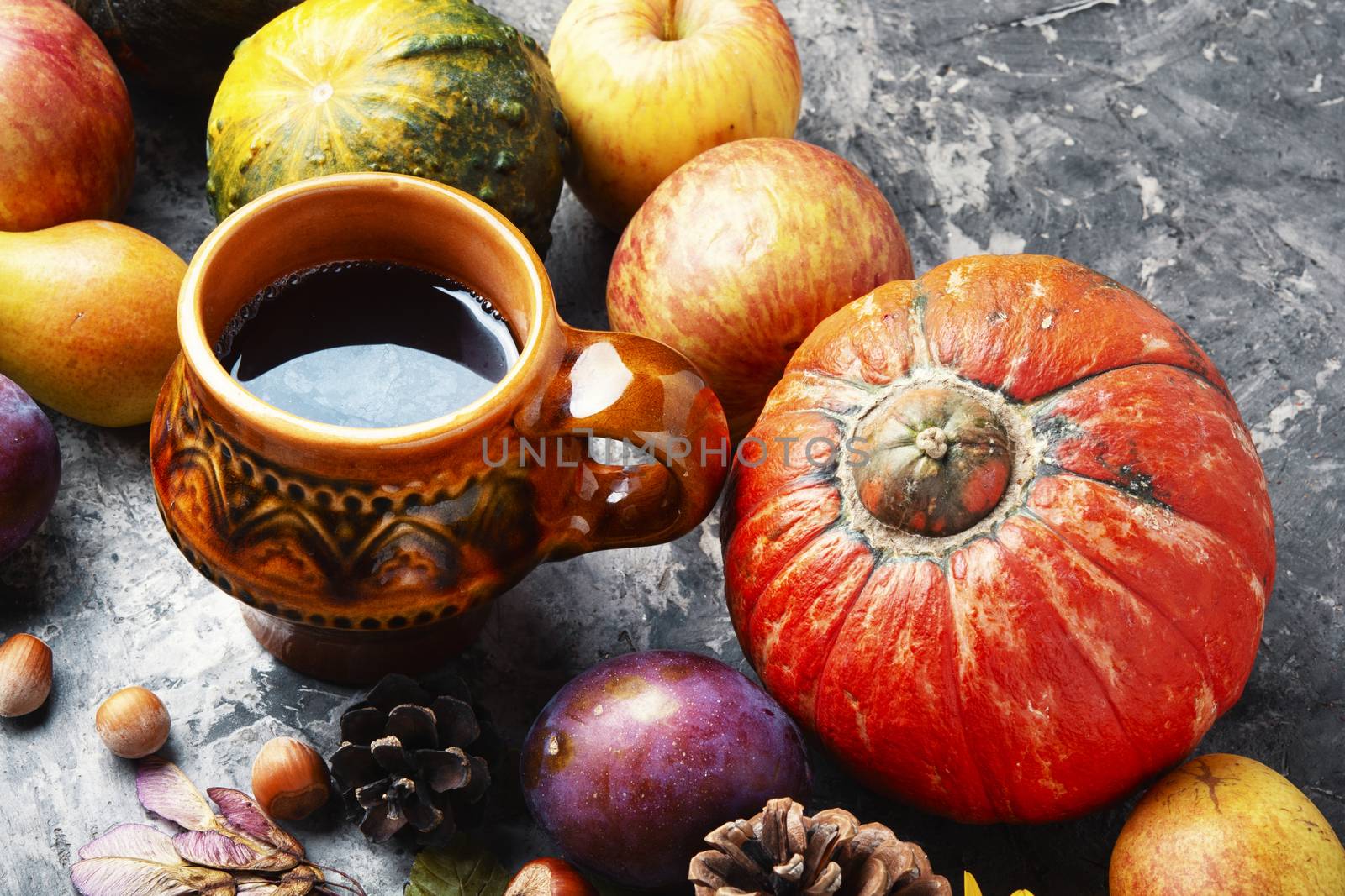 Autumn composing with pumpkin, fruit and fall leaves.Autumn background