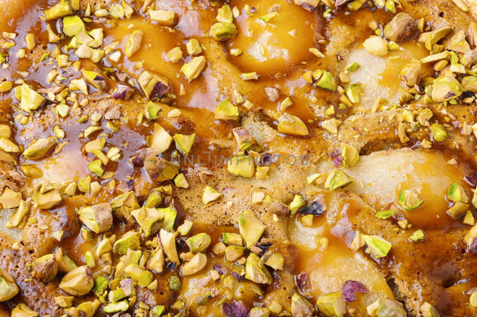 Autumn pie with pear and pistachio.Traditional autumn pie.Food background