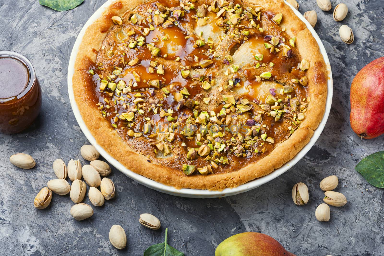 Autumn pie with pear and pistachio.Traditional autumn pie