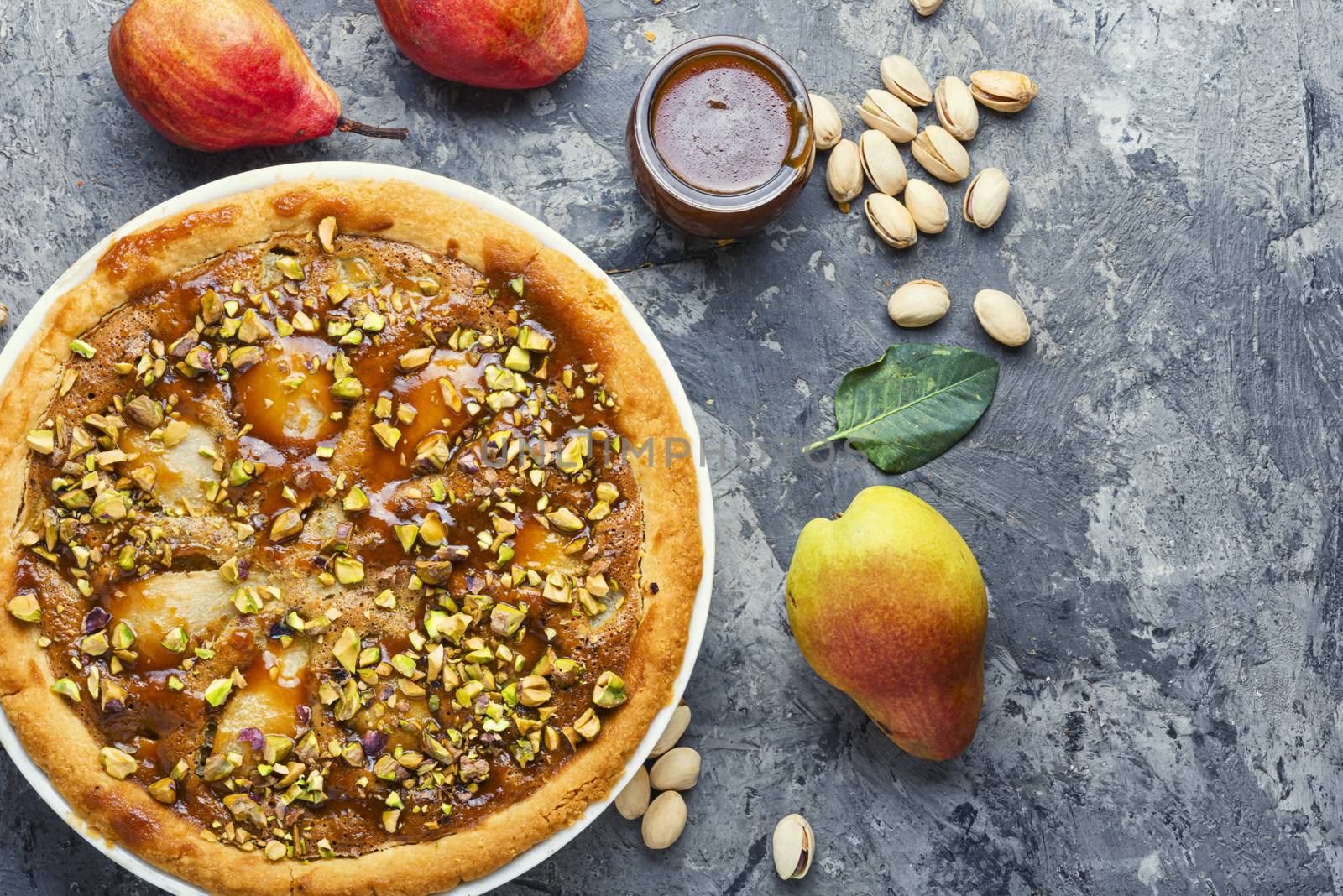 Autumn pie with pear and pistachio.Traditional autumn pie
